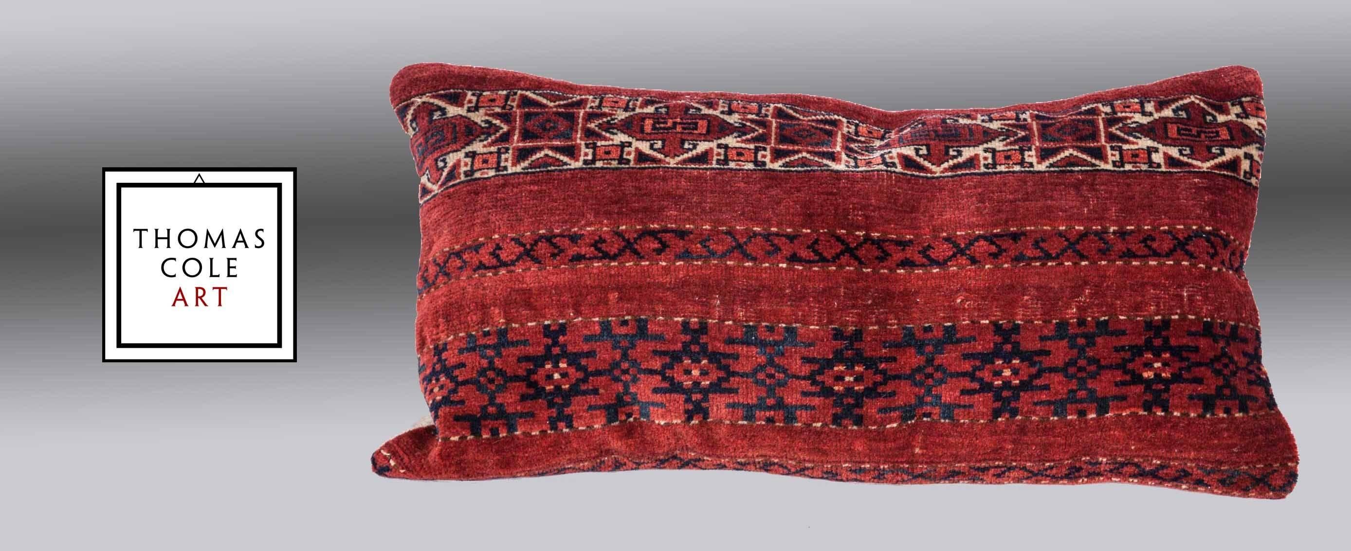 A pillow fashioned from a colorful Ersari Turkmen tribal rug. Measures: 30.7