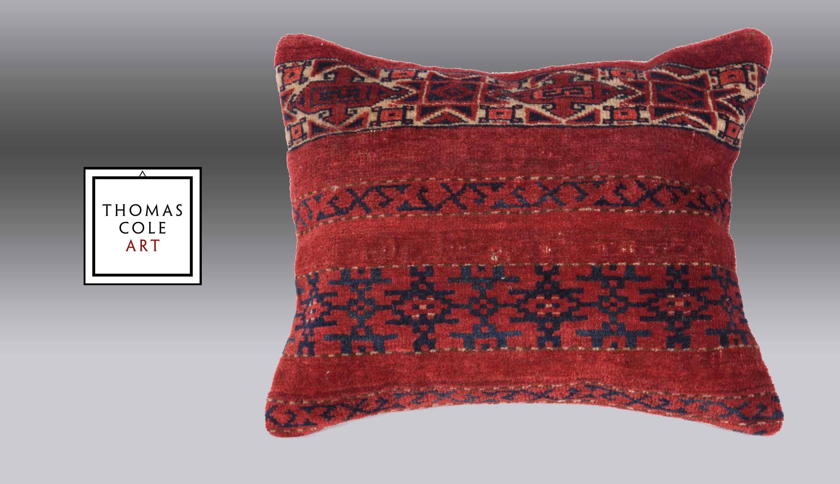 A pillow fashioned from a colorful Ersari Turkmen tribal rug. Measures: 19.68
