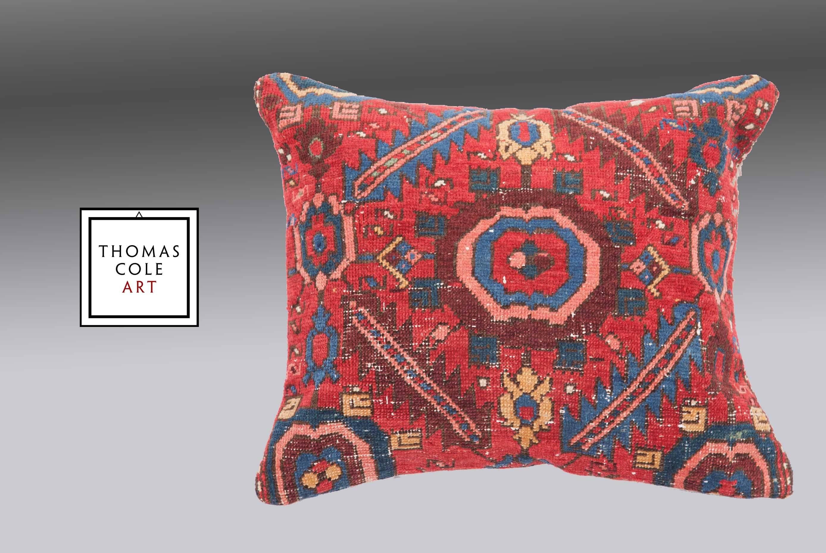 A pillow fashioned from a colorful Kurdish tribal rug. Measures: 22
