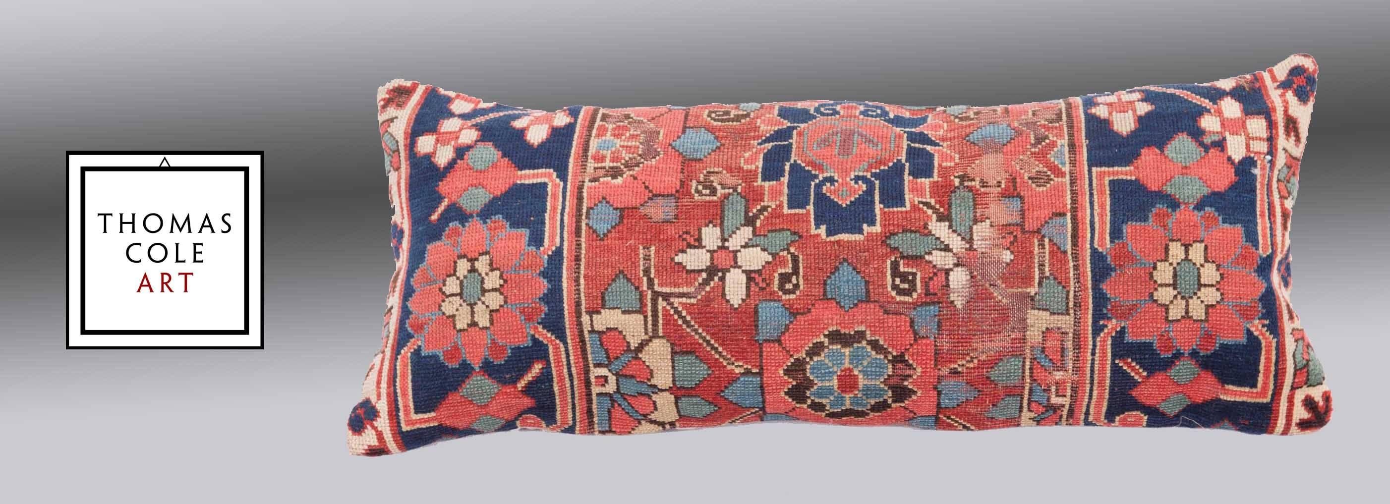 A pillow fashioned from a colorful Kurdish tribal rug. Measures: 36.2