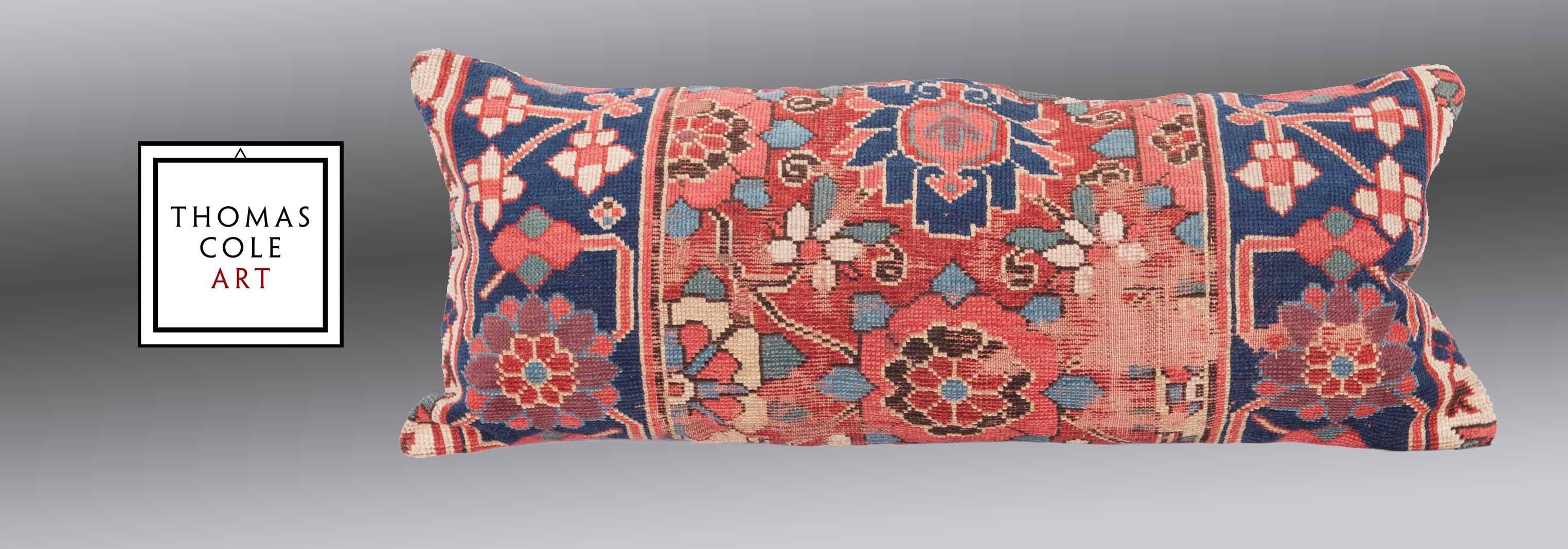 A pillow fashioned from a colorful Kurdish tribal rug. Measures: 35.4