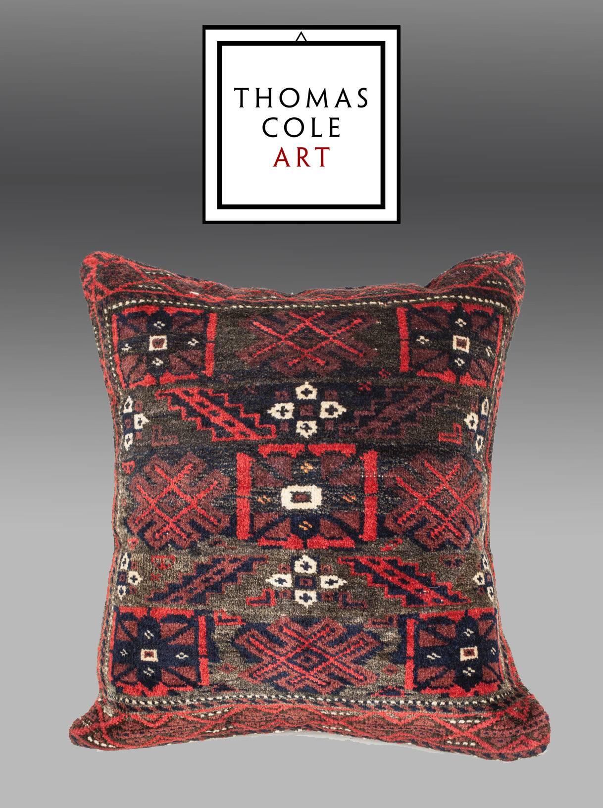 A pillow fashioned from an antique Baluch rug from NE Persia.  The pillow is in good conditioin, with no holes, repair or stains.

It comes with an insert to accomodate filling.
FILLING NOT PROVIDED
p4