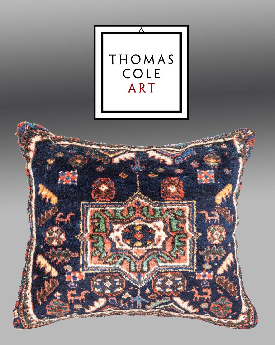 A pillow fashioned from an antique Afshar rug from south Persia. The condition is good, with no holes, repair or stains.

It comes with an insert to accommodate filling.
Filling not provided.

p6.