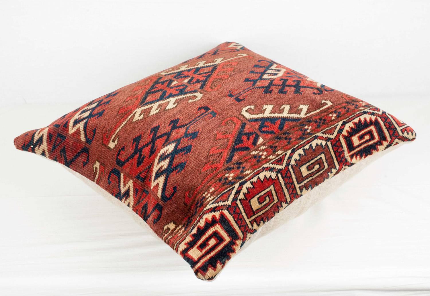 A pillow fashioned from a colorful Yomut Turkmen/Turkoman tribal bag.  The colors are all derived from natural dyes and the condition is good, with no holes, repair or stains.

It comes with an insert to accomodate the filling.
FILLING NOT