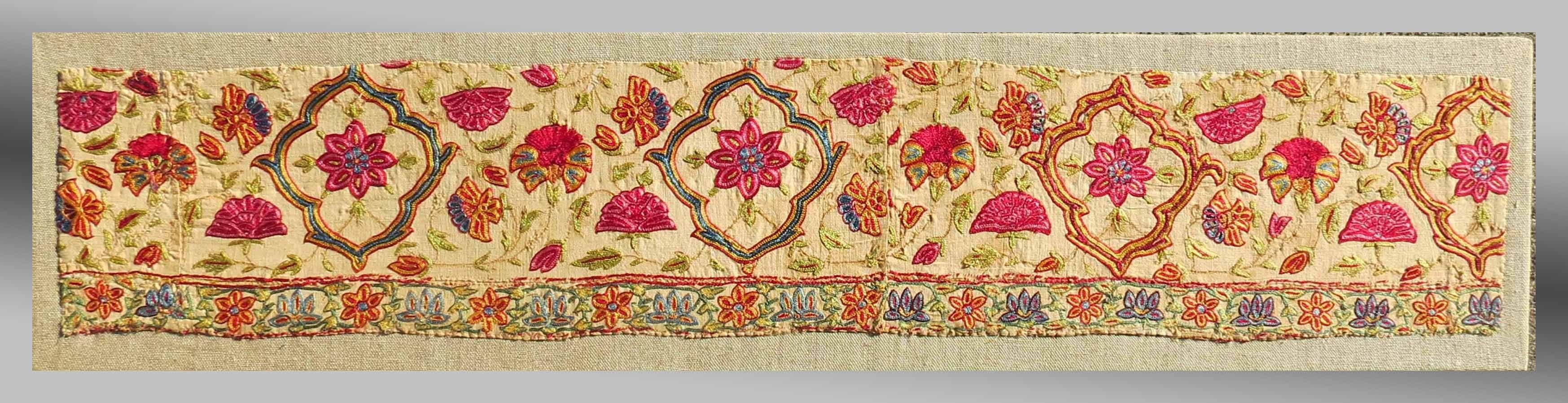 An excellent example of silk on linen embroidery from West India. Probably once the border of a larger panel, the open drawing of the design coupled with brilliant colors suggest an aesthetic that might actually date earlier than the proposed