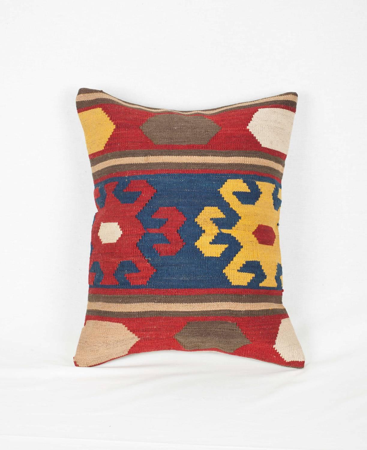 A pillow fashioned from an antique Caucasian Kilim, all natural dyes, in good condition.

It comes with an insert to accomodate filling.
Filling not provided.

p1.