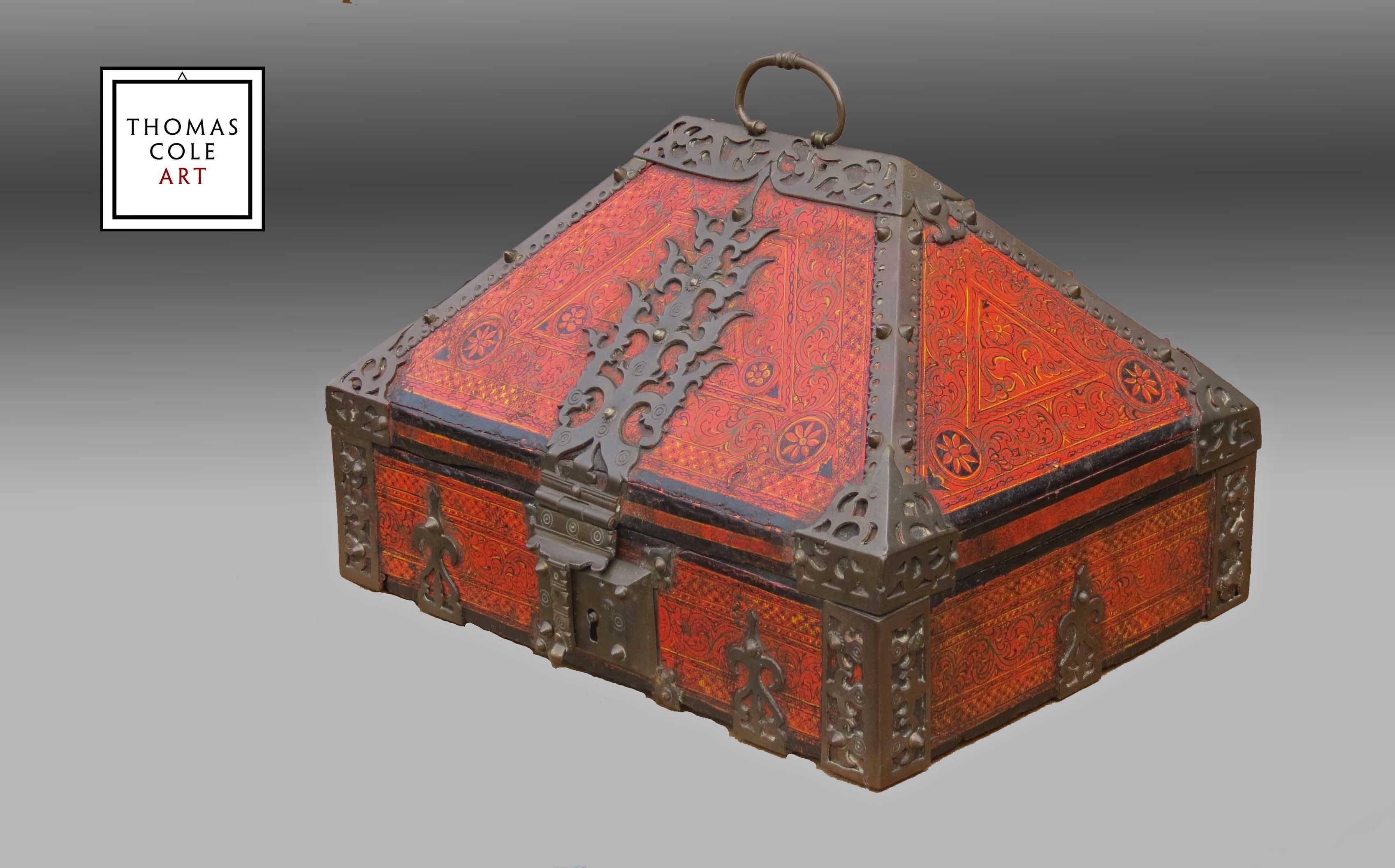 A jewelry box with antique iron decorations (and hinges) of fine jack wood by the ancient carpenters of ancient Kerala.. Boxes of this style are known as “Malabar boxes” or nettur boxes in Kerala. Lacquer and oil painted designs cover the