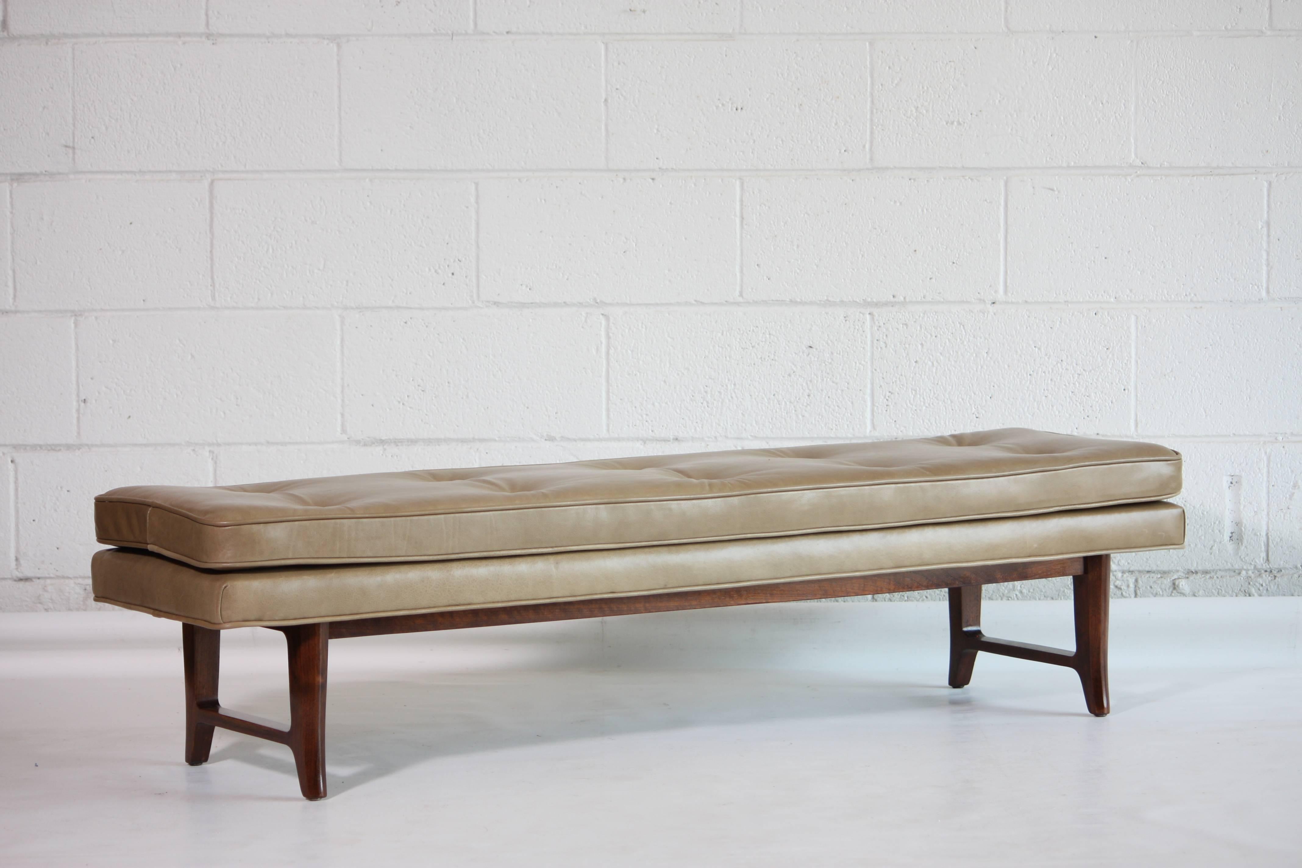 Absolutely stunning bench designed by Edward Wormley for Dunbar. This piece has been professionally refinished and reupholstered in an amazing leather hide. Retains Dunbar labeling.