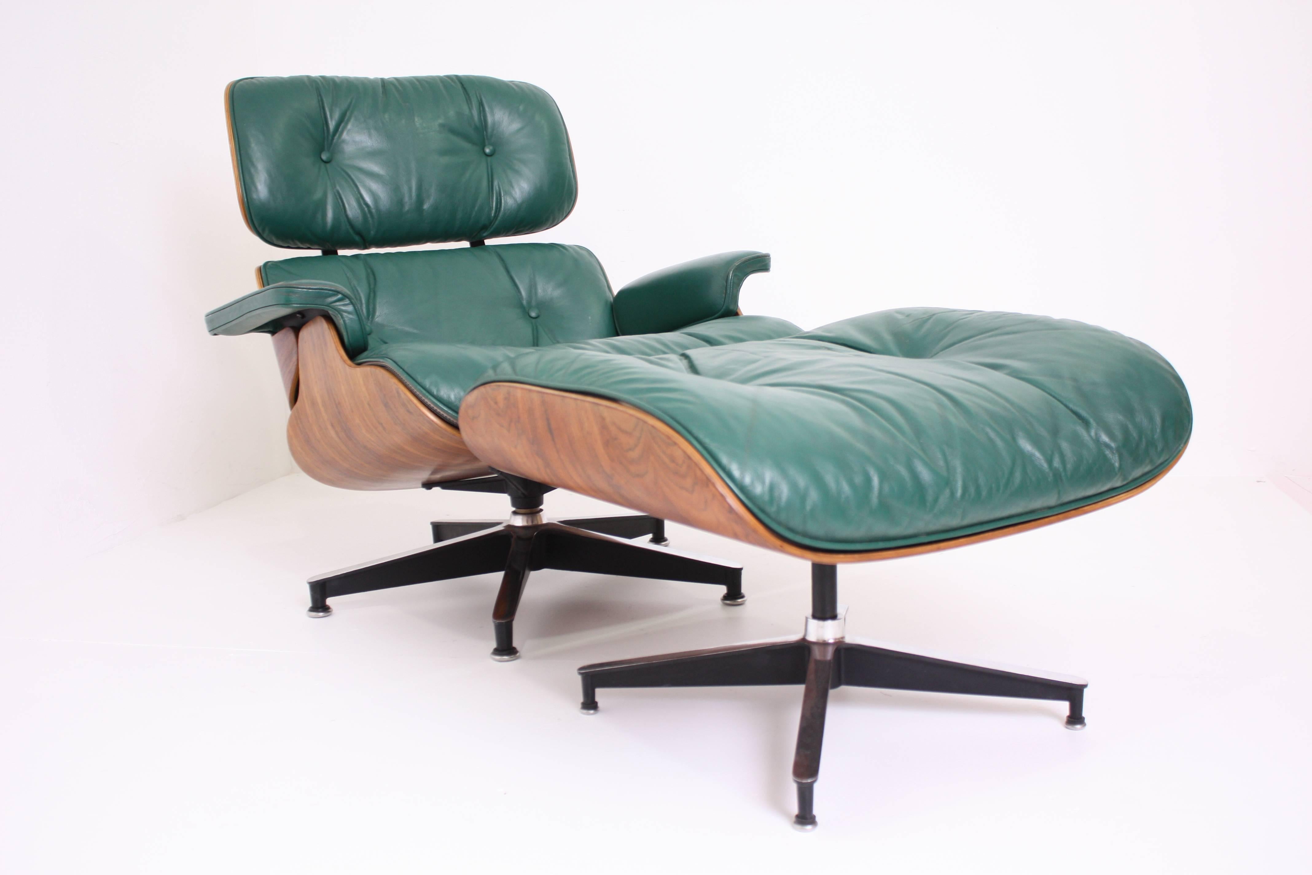 Rare special order green leather lounge chair and ottoman designed by Charles and Ray Eames for Herman Miller.