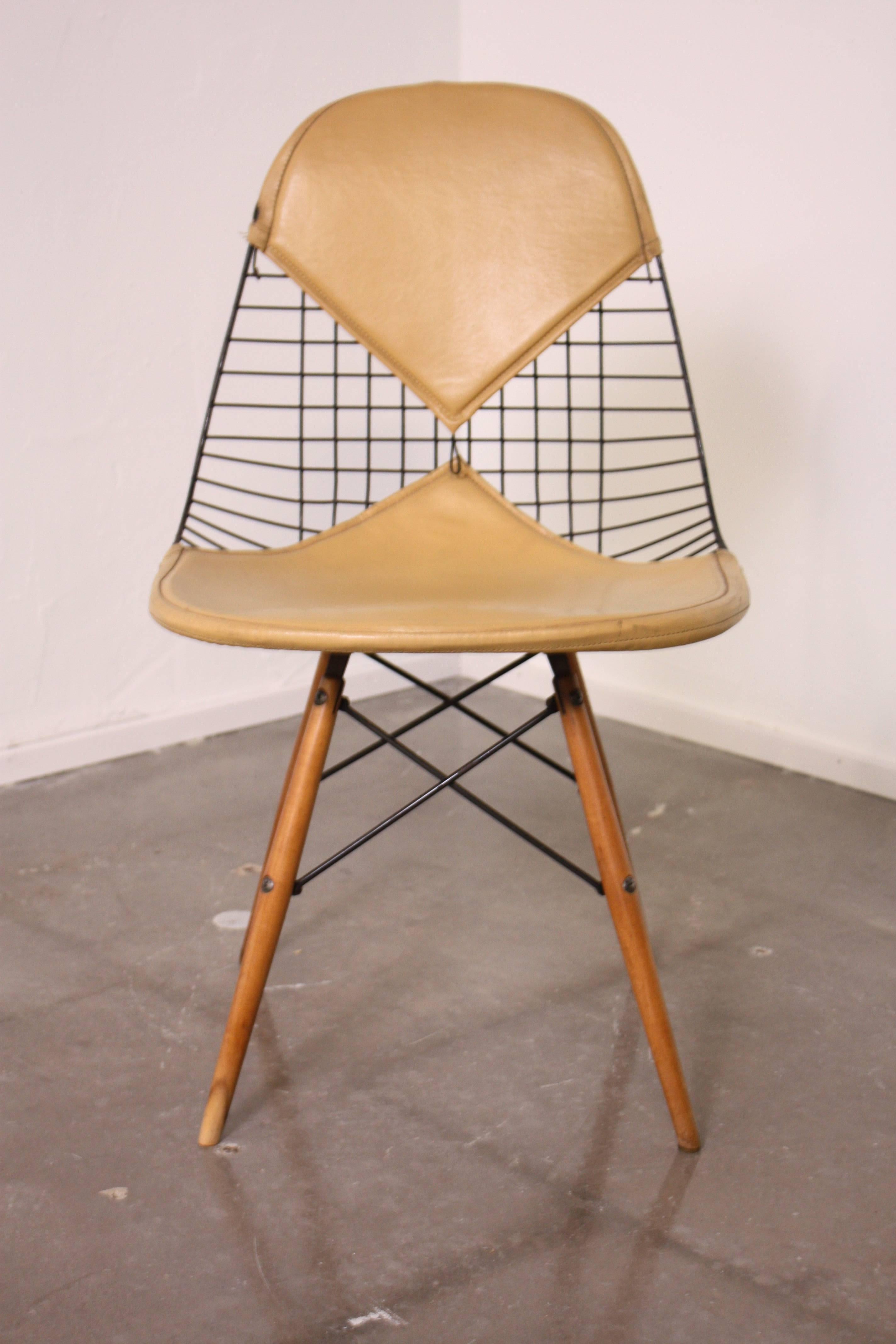 Early production Eames DKW dowel leg side chair with bikini cushion by Herman Miller.