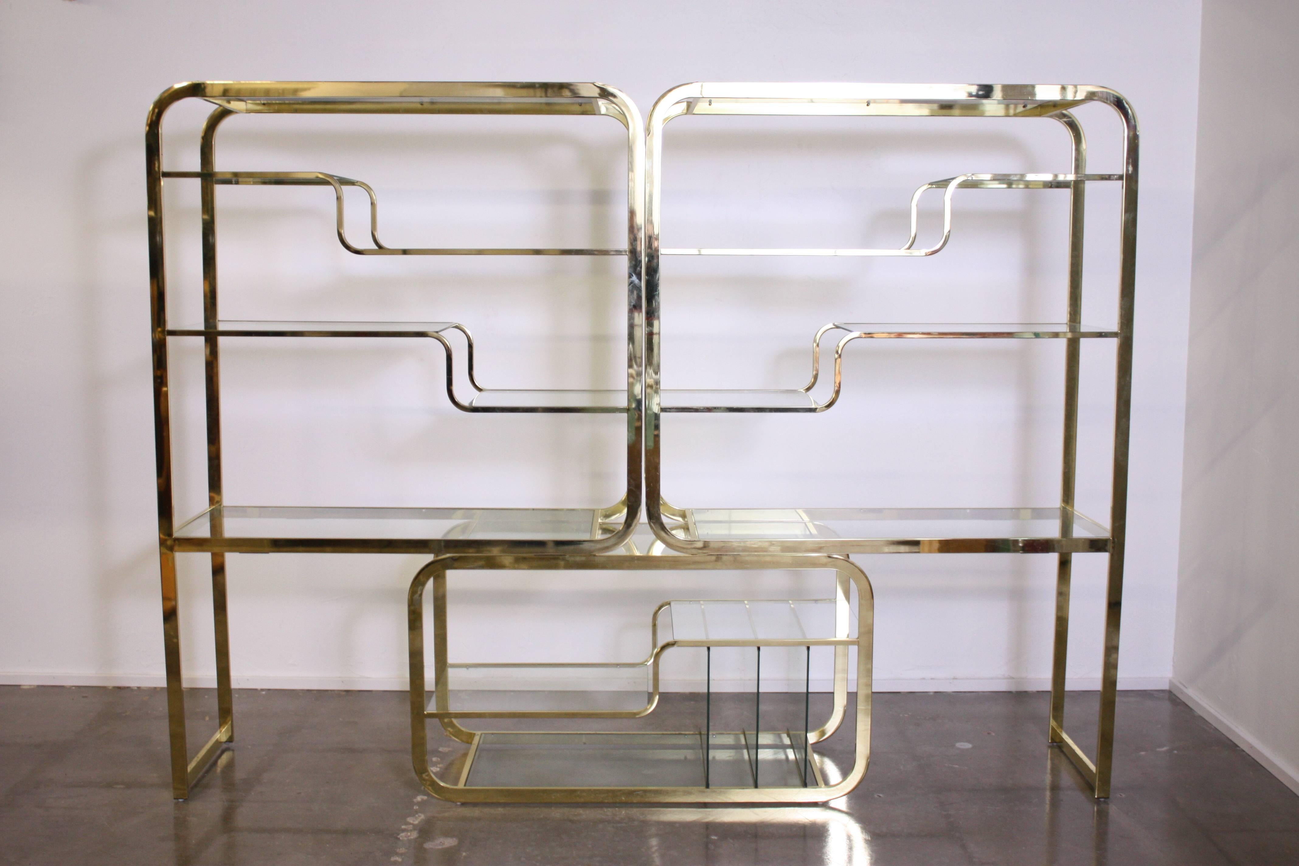 Large double cantilever brass étagère by Milo Baughman for Design Institute America, with magazine/record holder. Pieces are expandable top add width.