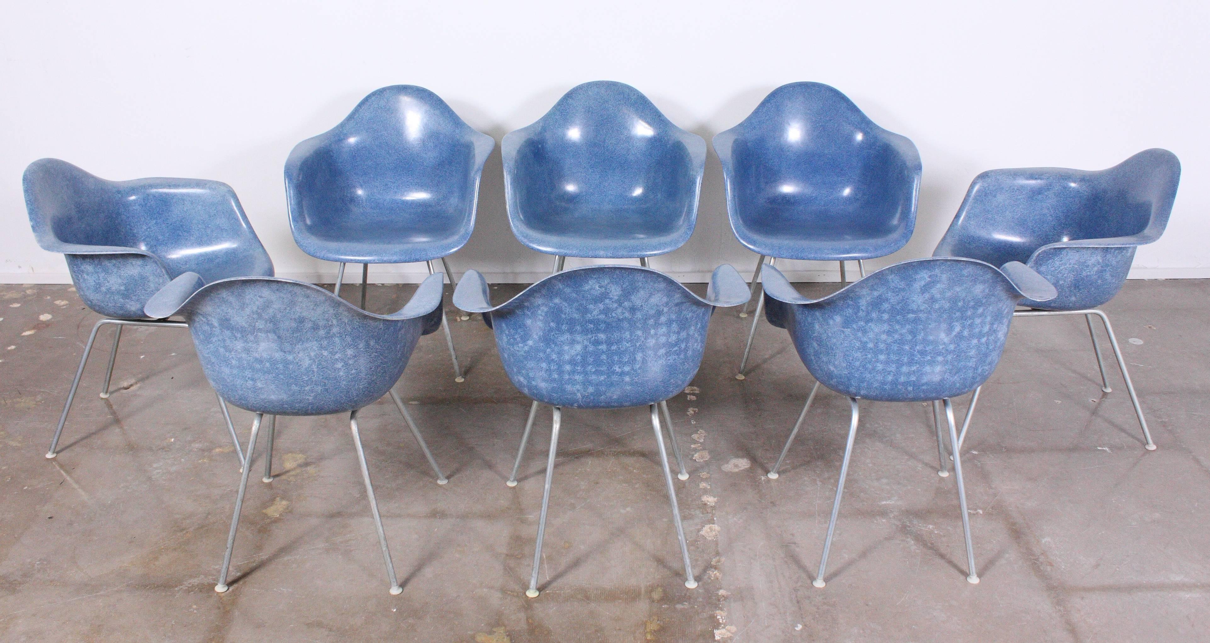 Rare set of eight, highly sought after blue fiberglass shell chairs designed by Charles and Ray Eames for Herman Miller.