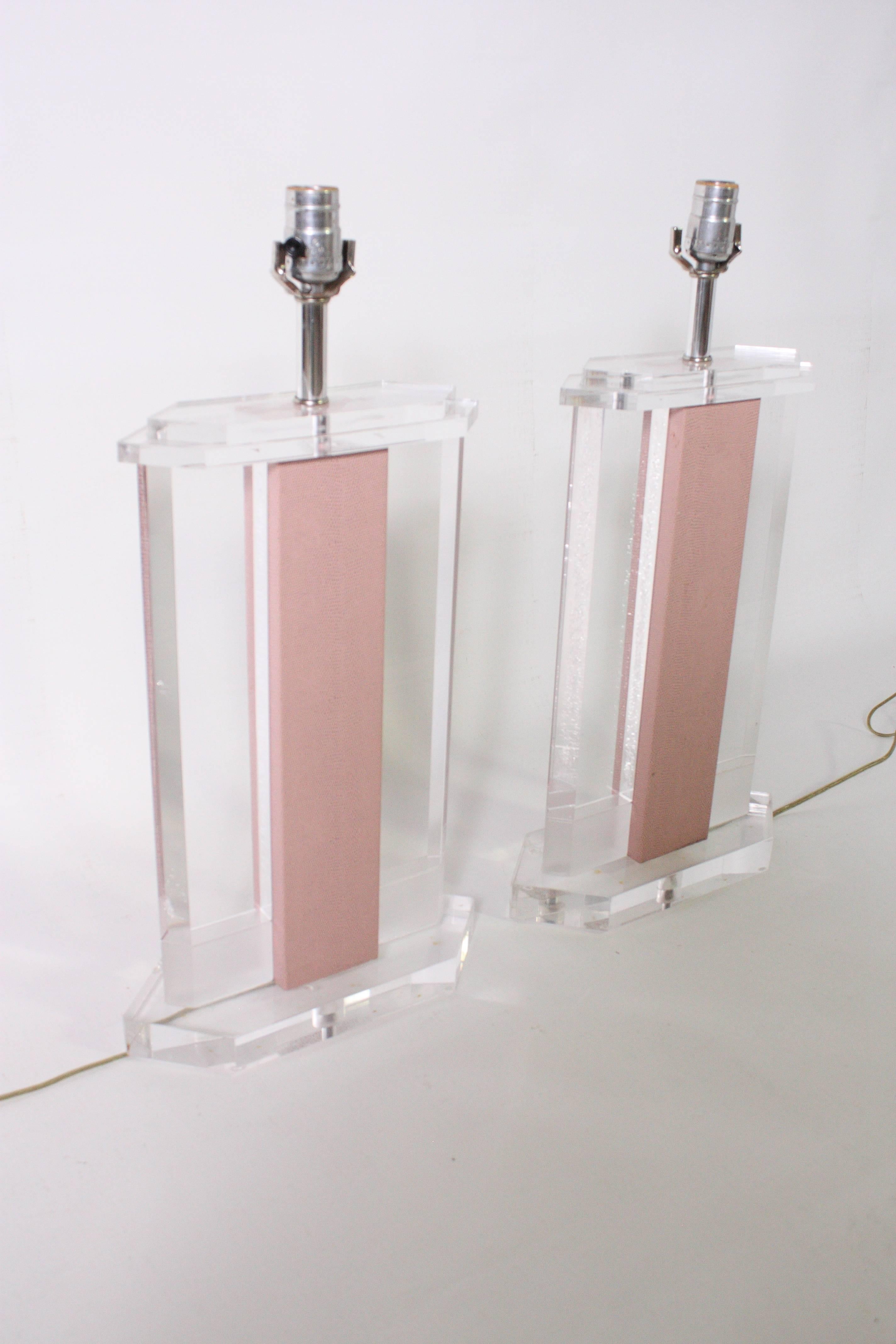 Absolutely gorgeous Lucite lamps detailed with pink snake skin style leather in the style of Karl Springer.