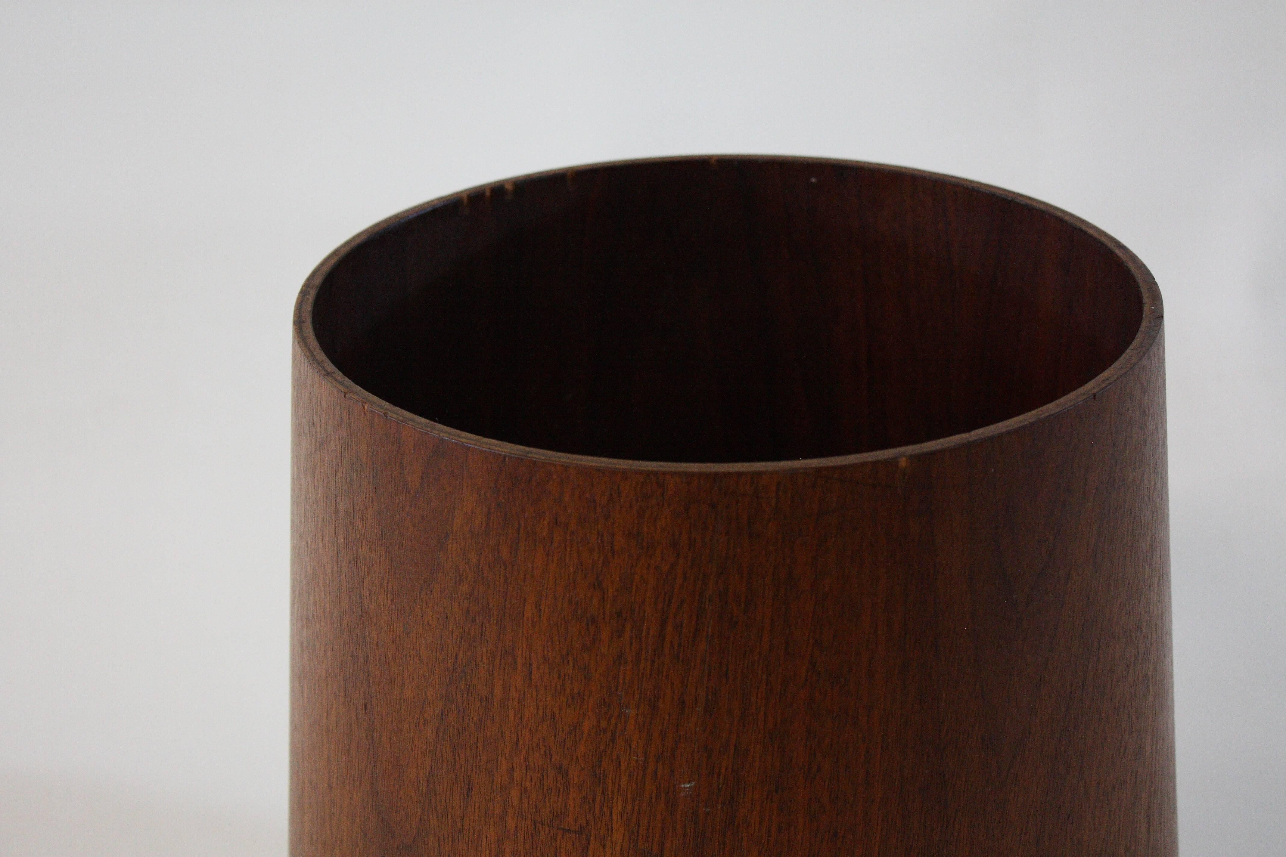 Design is all in the details, down to the wastebasket. This wastebasket with a smaller opening and wider base by Jens Risom is a wonderful example of his attention to detail. Retains original label. From the curated collection Space 20th Century