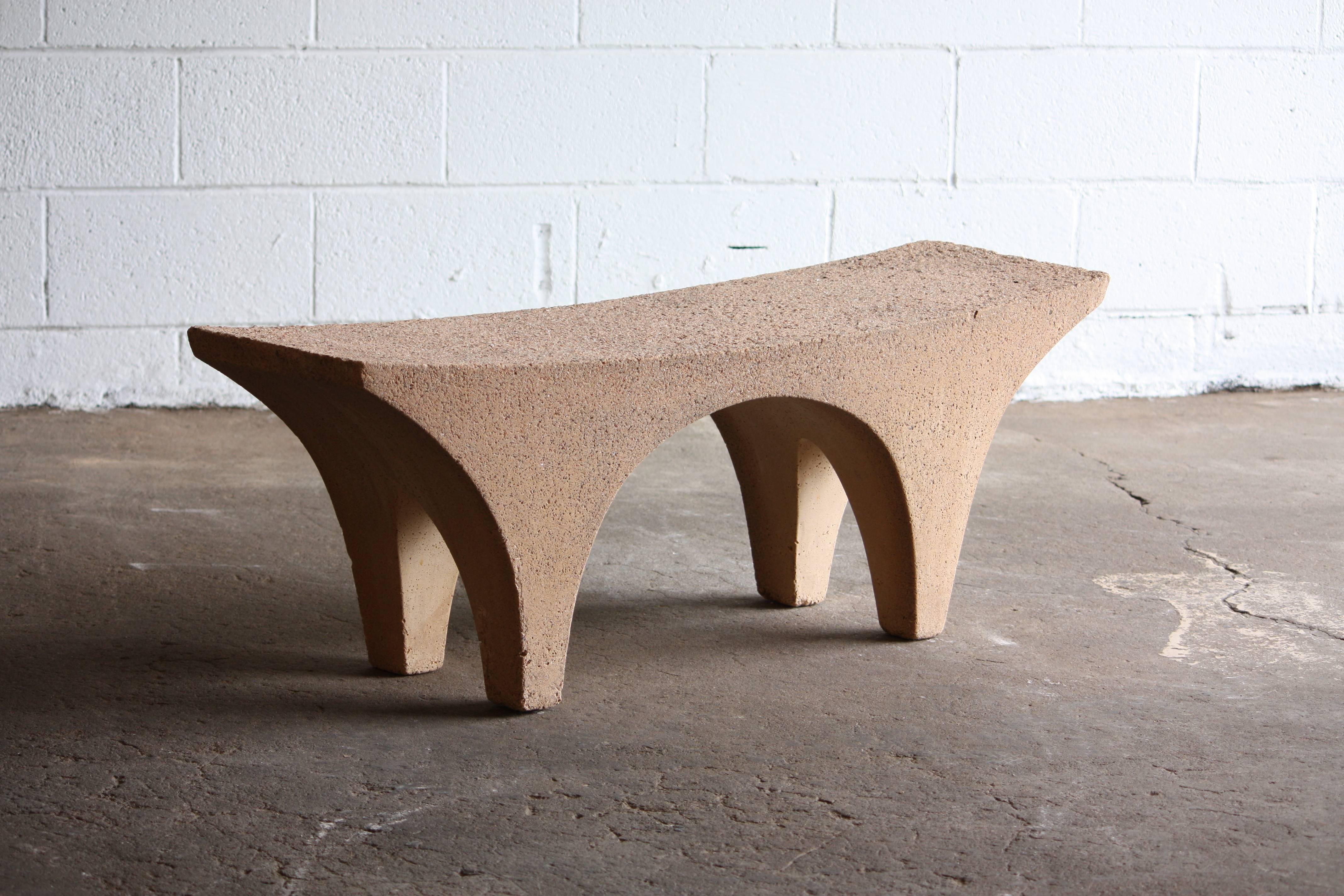 Wonderful concrete bench for indoor or outdoor use. This bench says a lot with its curves and textures.