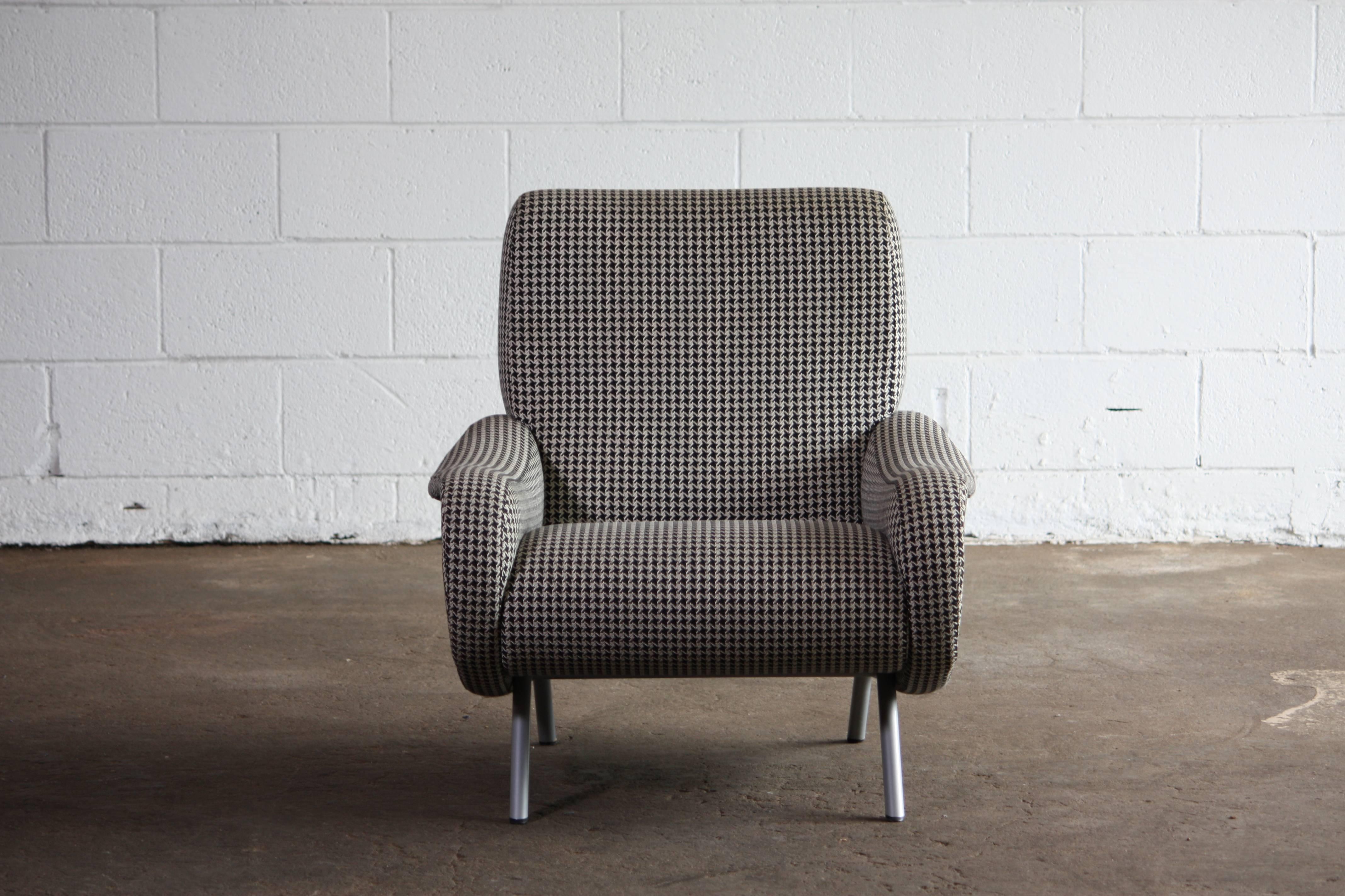 Amazing armchair upholstered in the original black and white hounds tooth. Designed by Marco Zanuso for Arflex. Retaining original labelling and glides.
