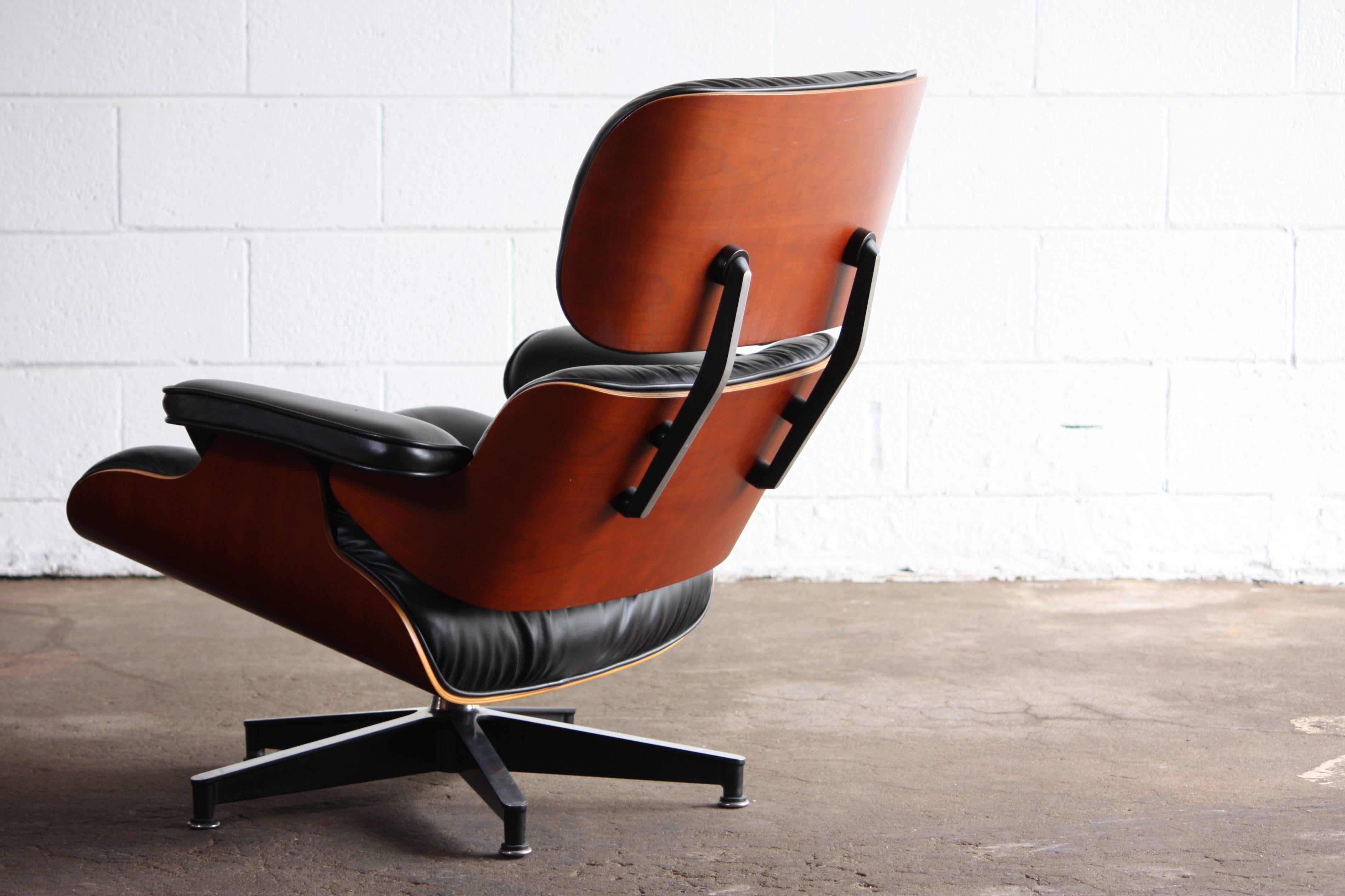 The iconic lounge chair. A must have in any modern interior. Gorgeous cheerywood and black leather.