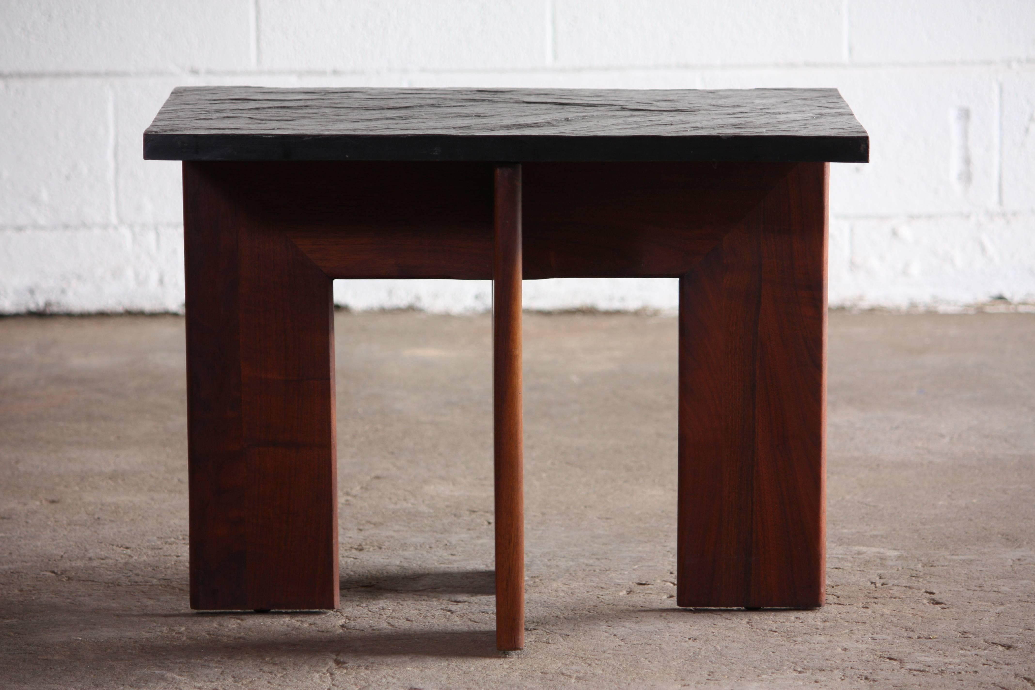 Unique slate top with walnut wood base side table or smaller cocktail table designed by Adrian Pearsall.