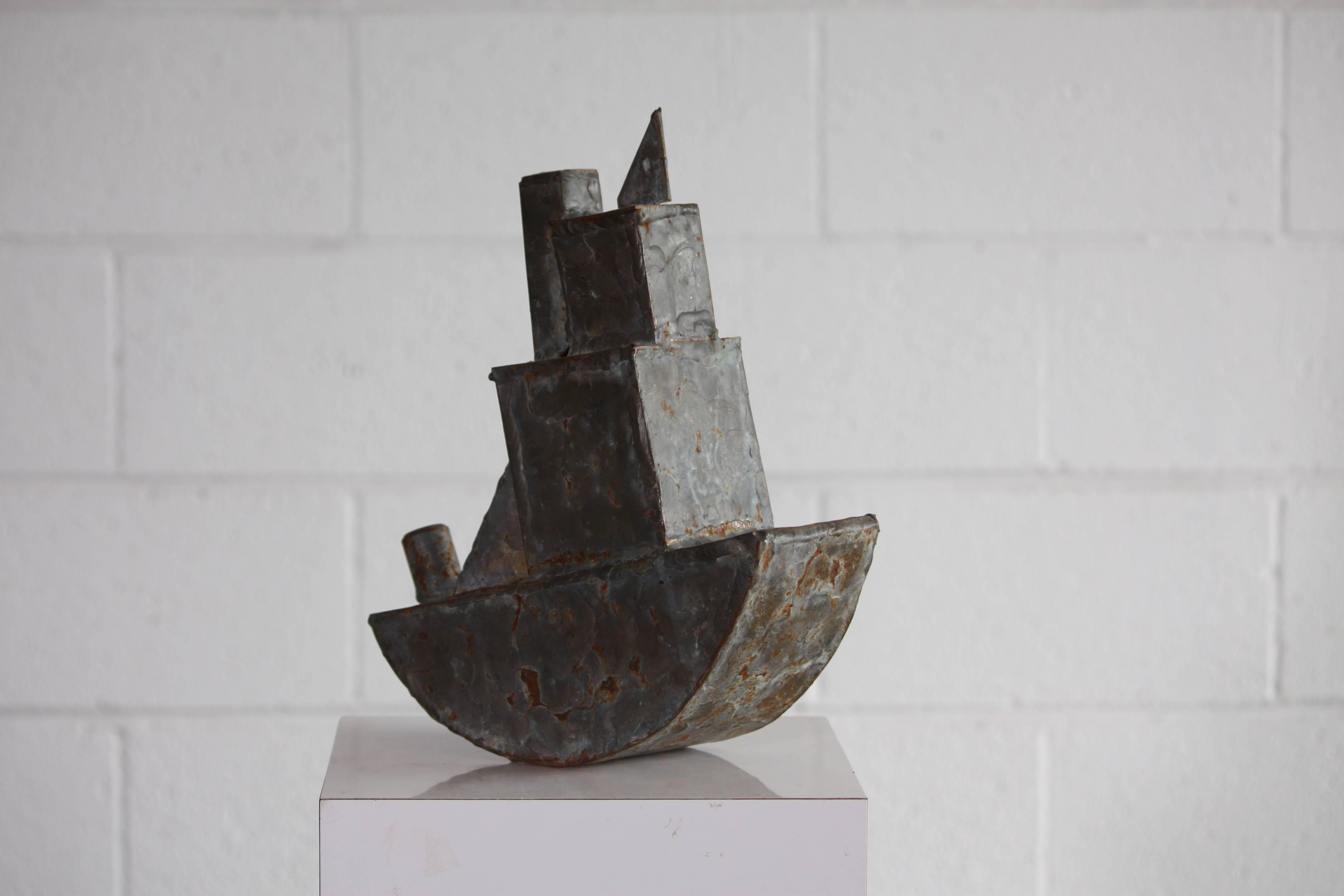 Unique handmade steel tugboat with patinated brass brazing finish. A wonderful addition to any boat collection or decorative piece. From the curated collection Space 20th Century.