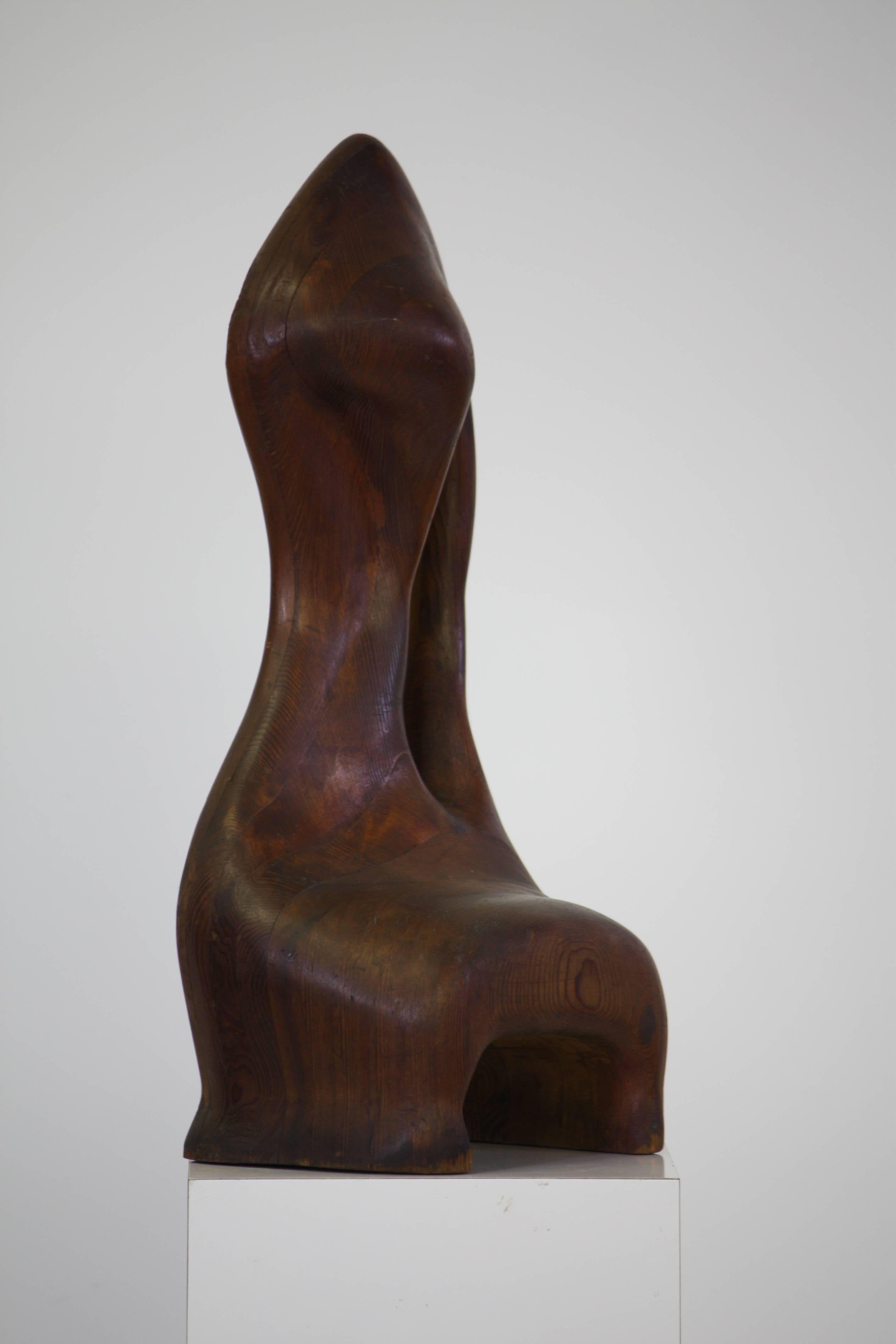 Wonderful organic shaped vintage wood table top sculpture. This hand-carved pieces is made of layers and emulates the work done by Wendell Castle. From the curated collection Space 20th Century.