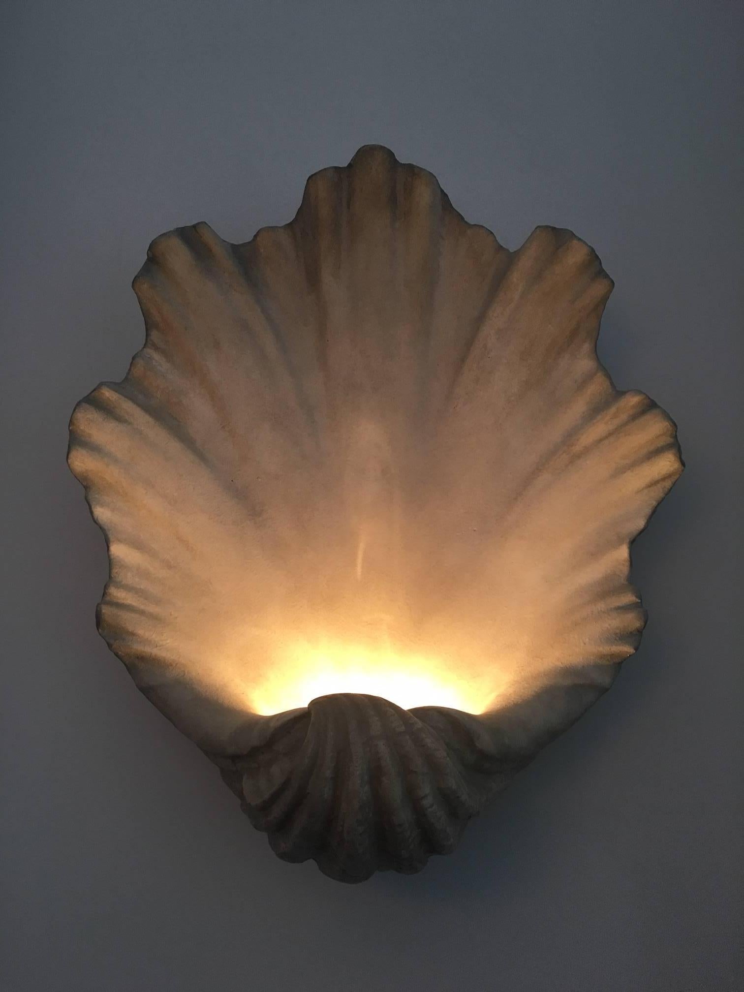 A pair of modern and very decorative scallop shell wall lights, in 1940s style antiqued plaster. Made in London in 2010.