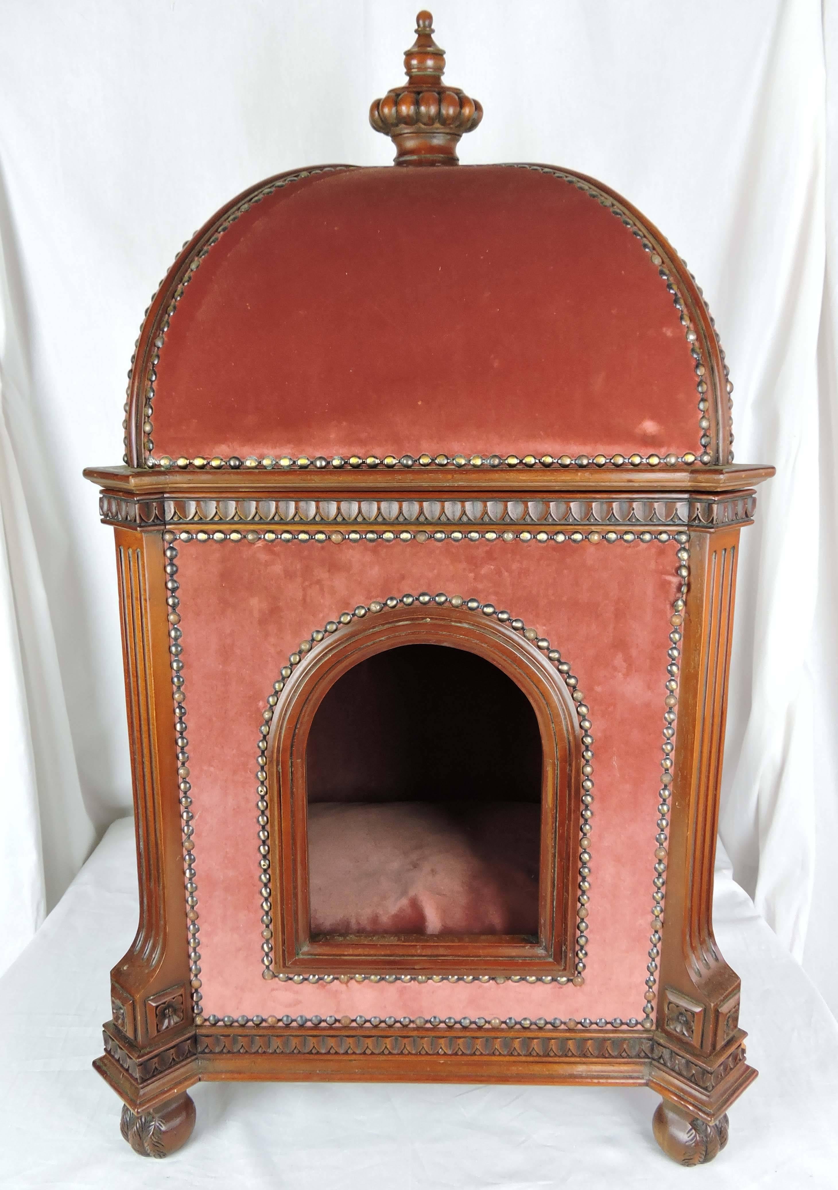 The last word in luxury for your preferred domestic companion: We offer a Louis XVI style pet bed of mahogany, upholstered inside and out, in Vieux Rose cotton velvet, with a removable cushion. The exterior framing has carved detailing. The pet bed