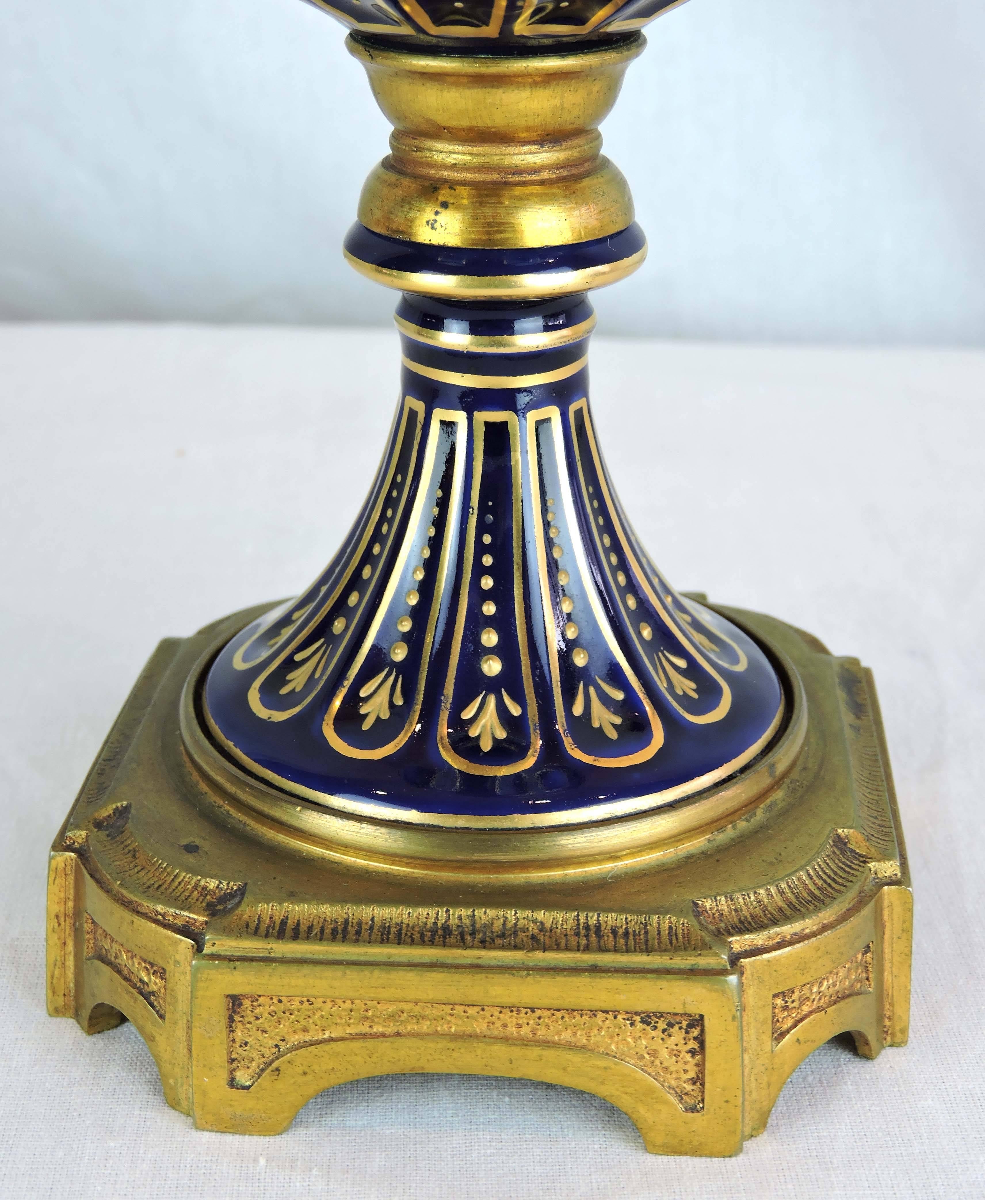 Pair of French Sevres Style Porcelain and Gilt Bronze Lidded Baluster Urns For Sale 1