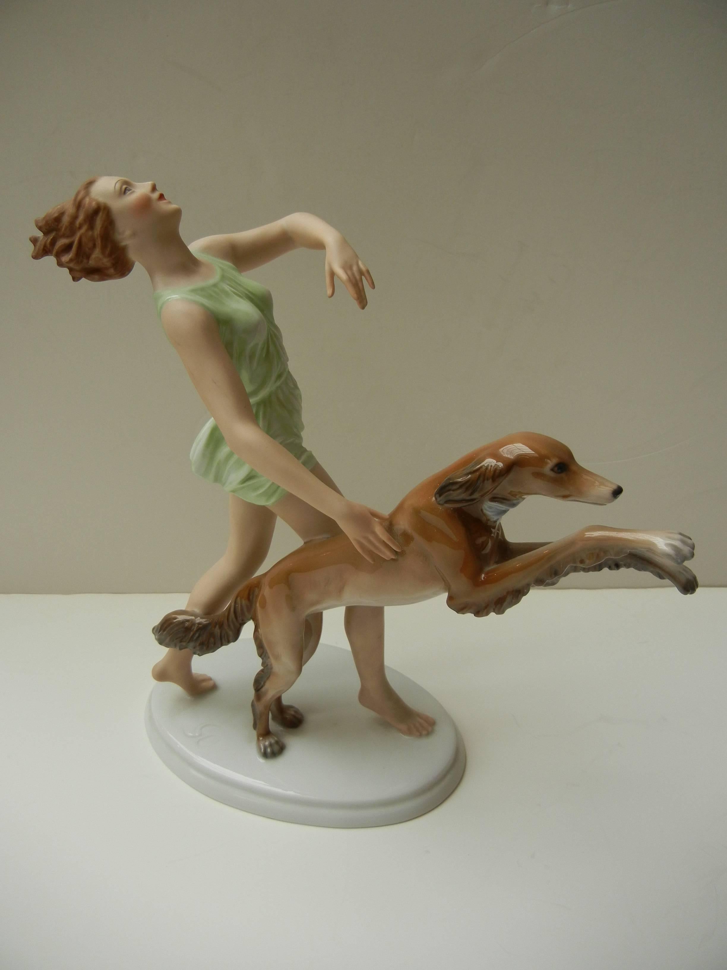 A lovely Art Deco figure by Rosenthal featuring a lady running beside a Saluki dog designed by Gustav Oppel. Originally designed for the 1936 Olympics.

Signed GO on top of base and marked with Rosenthal round mark on bottom.

No damage or