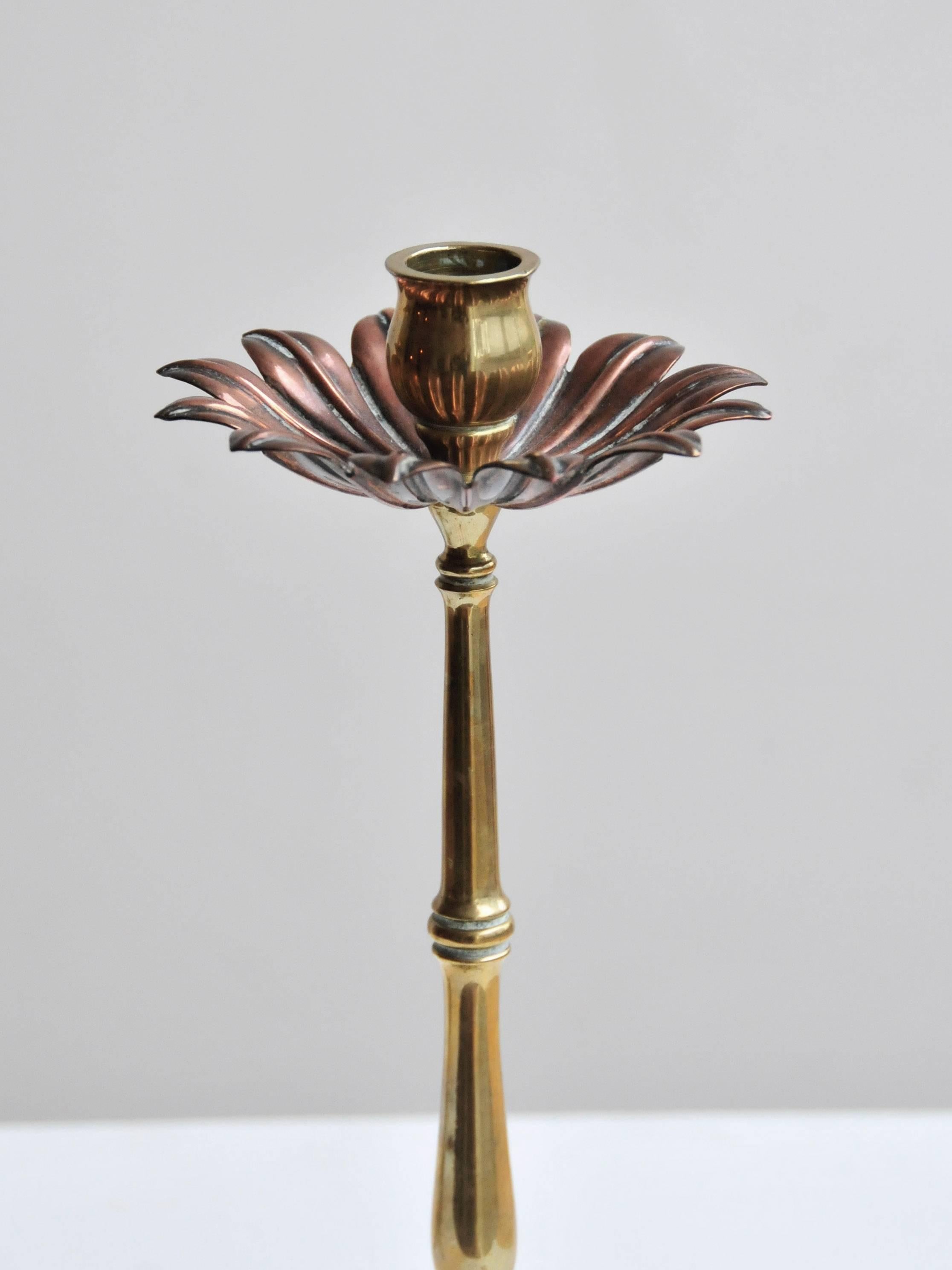 In the manner of W. A. S. Benson, in stylized plant form with copper petals on brass stem and four feet. In excellent original condition. 

England, circa 1900.
