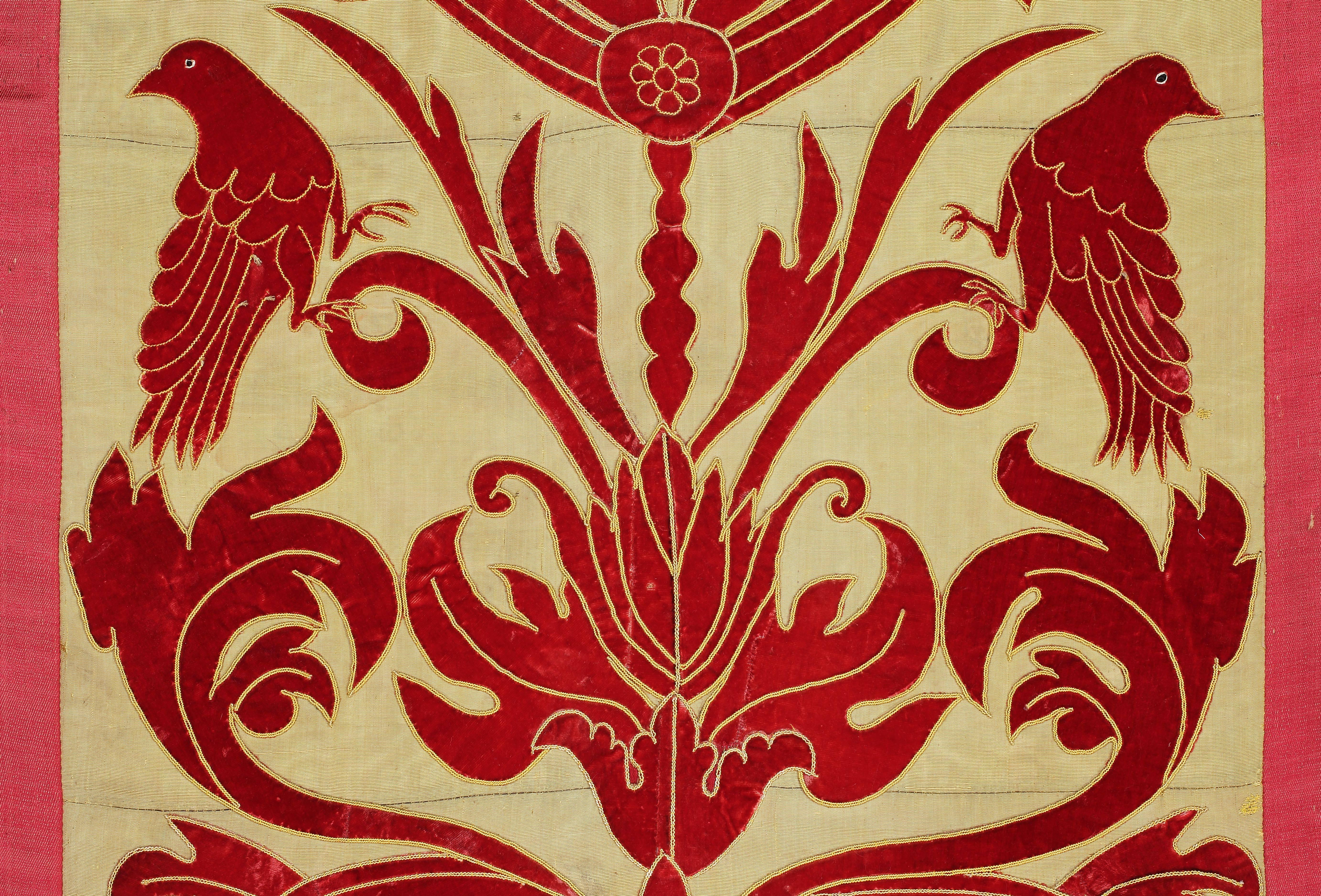 Panel of applique red velvet on a yellow silk ground, Italy, circa 1860.