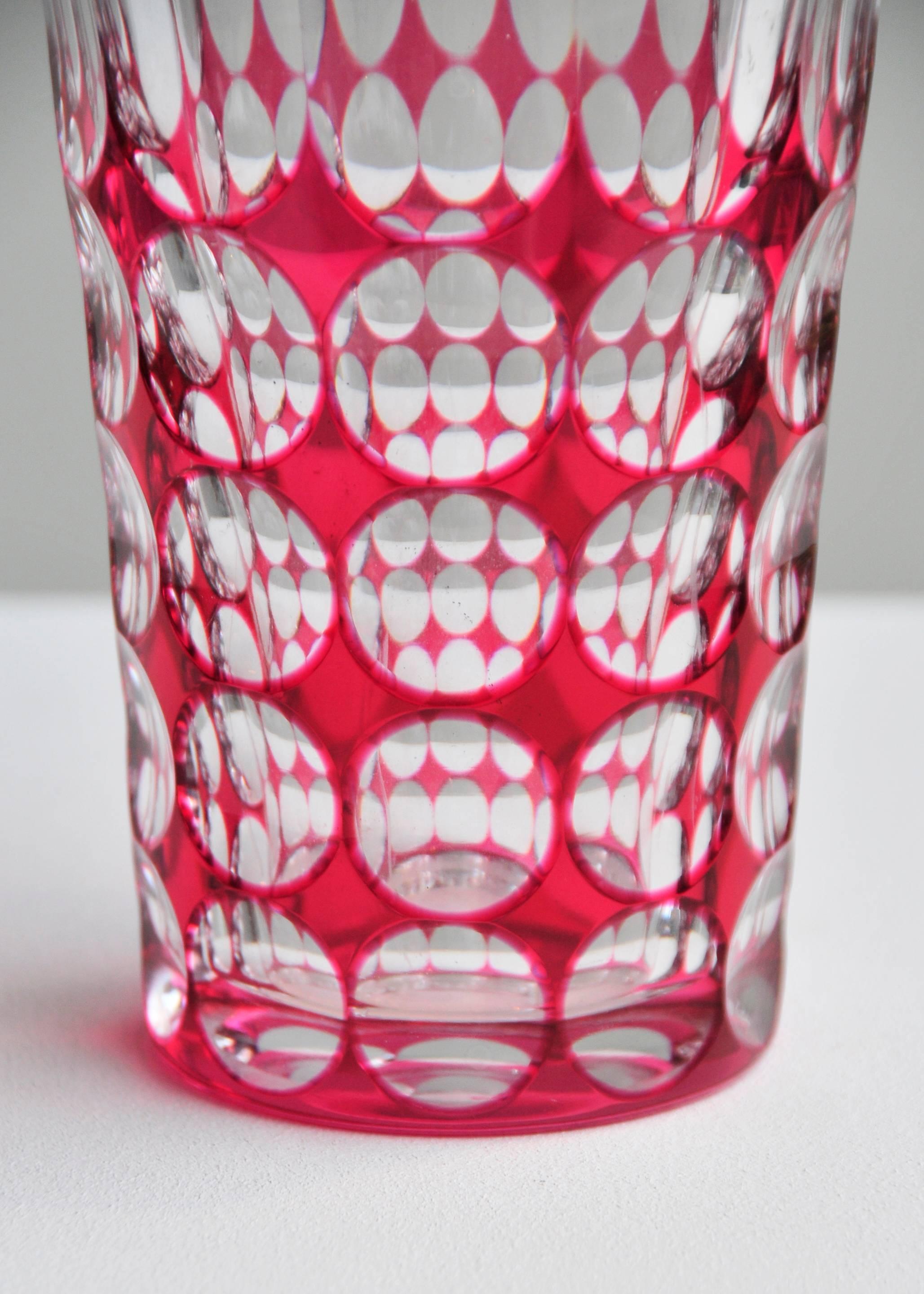 Geometric cut-glass with prismatic red coloring.

Belgium, early 20th century.
