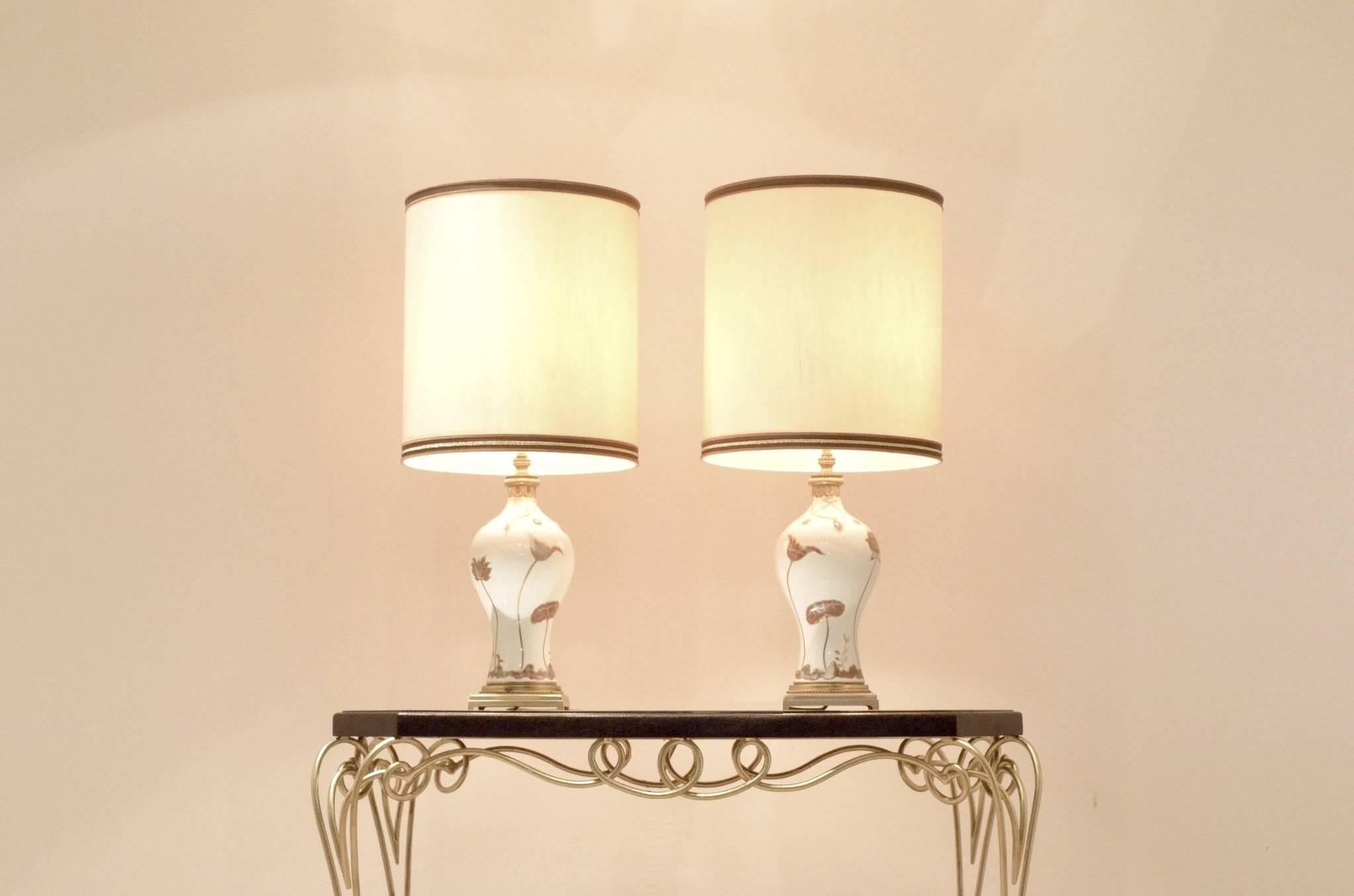 Extra large sized pair of midcentury table lamps manufactured by porcelain de Sèvres in the 1960s, hand painted white porcelain feet parts matched with gilt bronze elements.
Measures: ø 37 x 82 / H 92 cm.