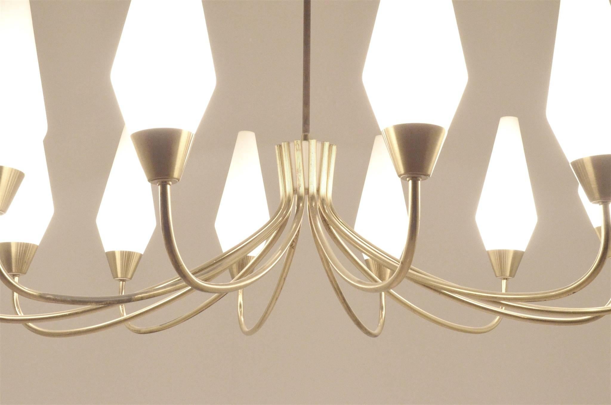 Large sized Italian Stilnovo chandelier - curvy brass arms topped by opalescent glass diffusers.