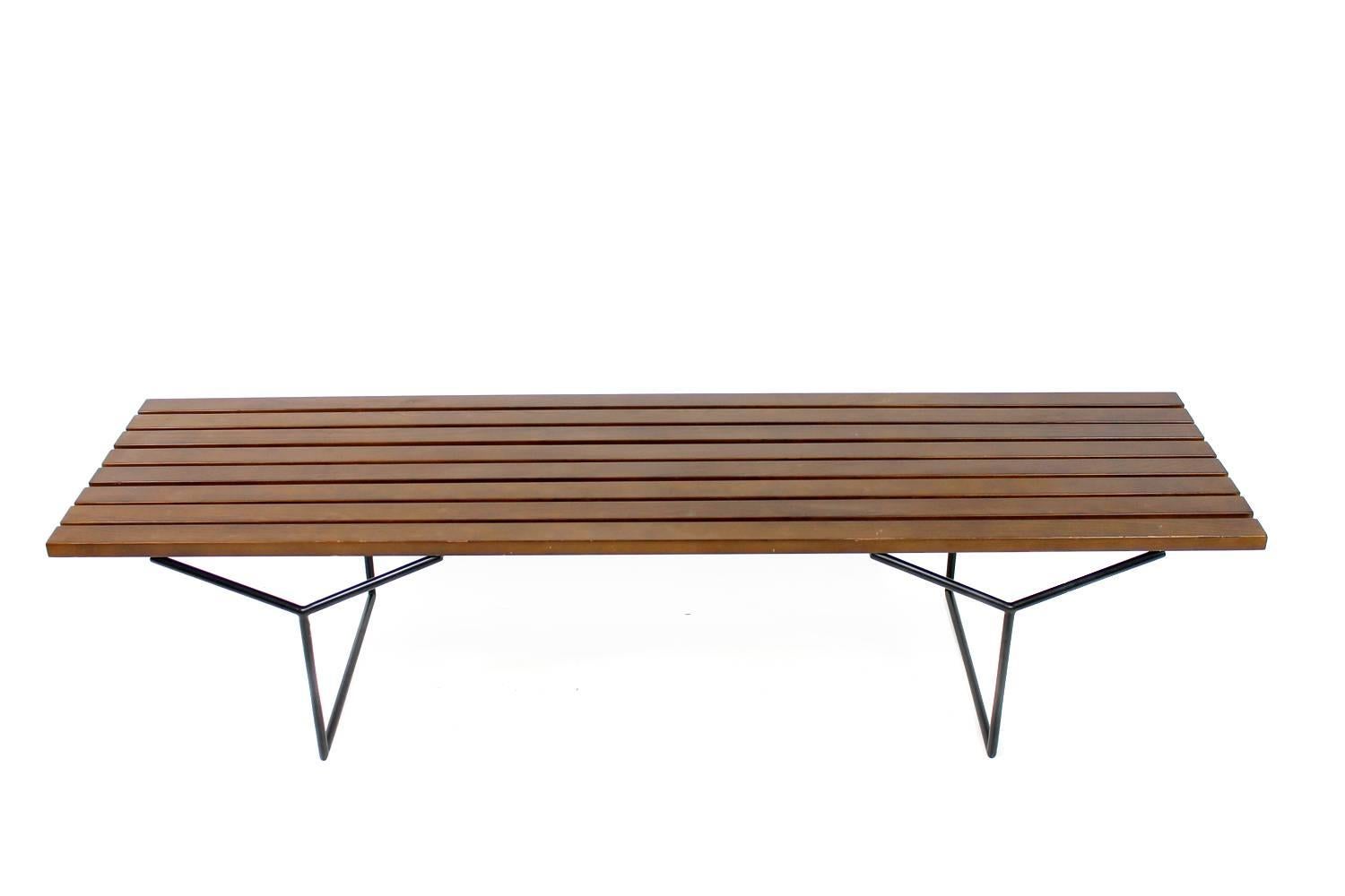 Beautiful bench, beechwood and metal frame, attributed to Harry Bertoia, was bought in the 1980s 
Good vintage condition, the beechwood dark stained, only minor wear consistent with age and use. The metal base is very good, the label is missing.

