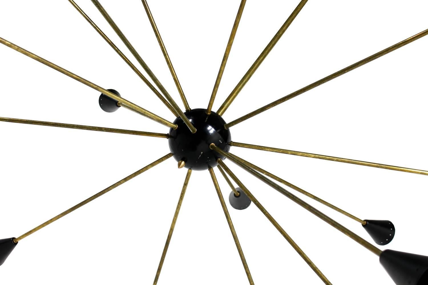 An Italian beauty, very large Sputnik chandelier with 16 arms in brass with beautiful, unique patina. The chandelier was already rewired and can be used in Europe and also in the US, for 16 x E14 (small edison) bulbs. Fantastic vintage condition,