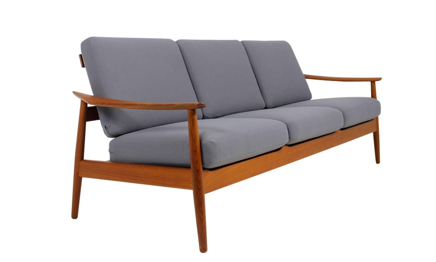 Beautiful 1960s Arne Vodder teak sofa, Danish modern design.
The innerspring cushions are reupholstered and covered with new grey woven fabric, really fantastic condition, like new, very clean, hard to find in this condition also a pair of matching