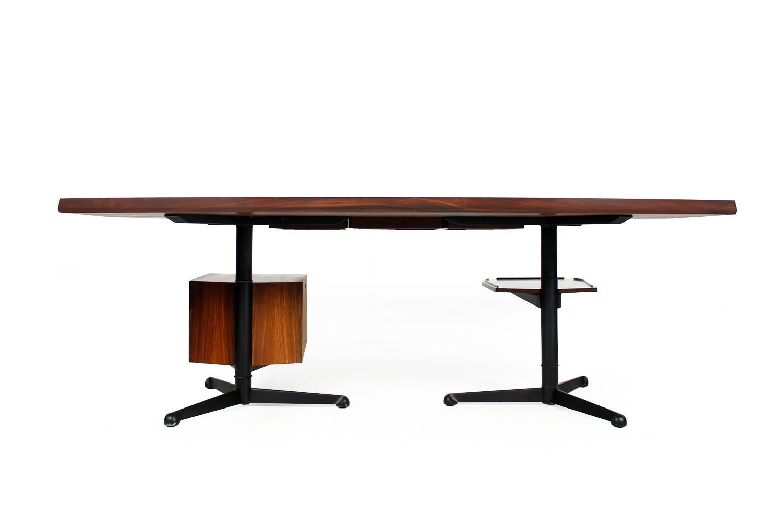 Rare T98 writing table, metal base, rosewood and leather.
Very large and heavy weight desk, fantastic vintage condition, this one was bought in 1969. 
The tray can be pulled out and it can be changed with the storage with three-drawer-unit can if