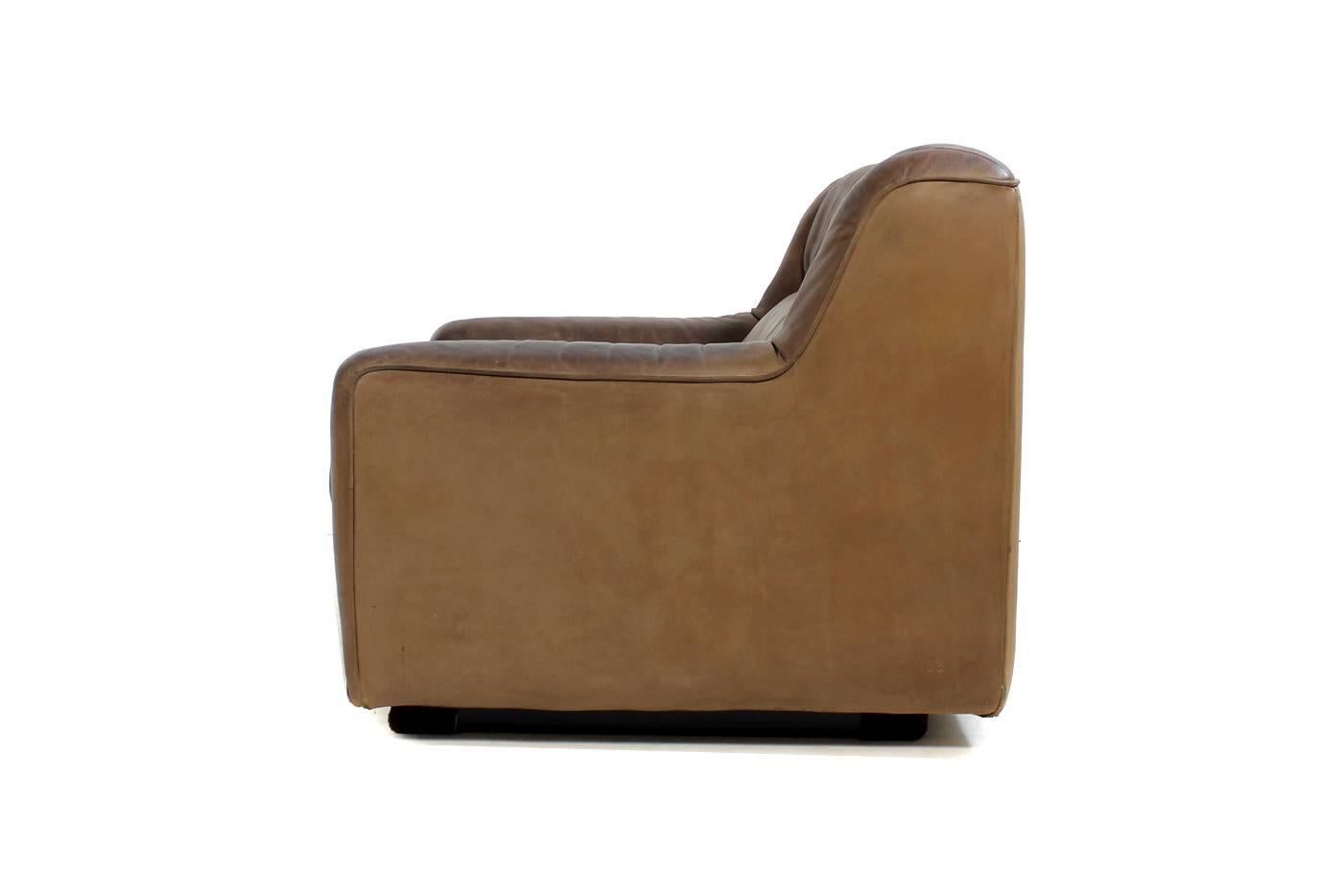 Beautiful dark cognac Vintage De Sede DS 43 lounge chair from late 1970s with an extendable seat for more comfort, fantastic vintage condition, heavy weight, high quality swiss made furniture, we have a matching sofa available, pls. visit our