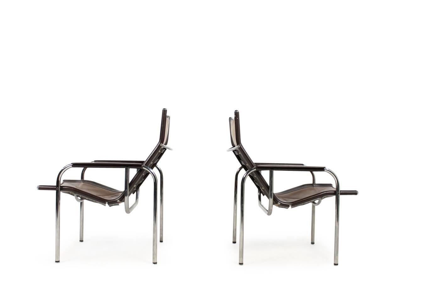 Beautiful pair of early, vintage 1970s lounge chairs by Hans Eichenberger for Straessle, Switzerland, Mod. HE. Fantastic vintage condition and unique patina on the dark brown and coffee tone leather, chrome in very good condition.
One matching