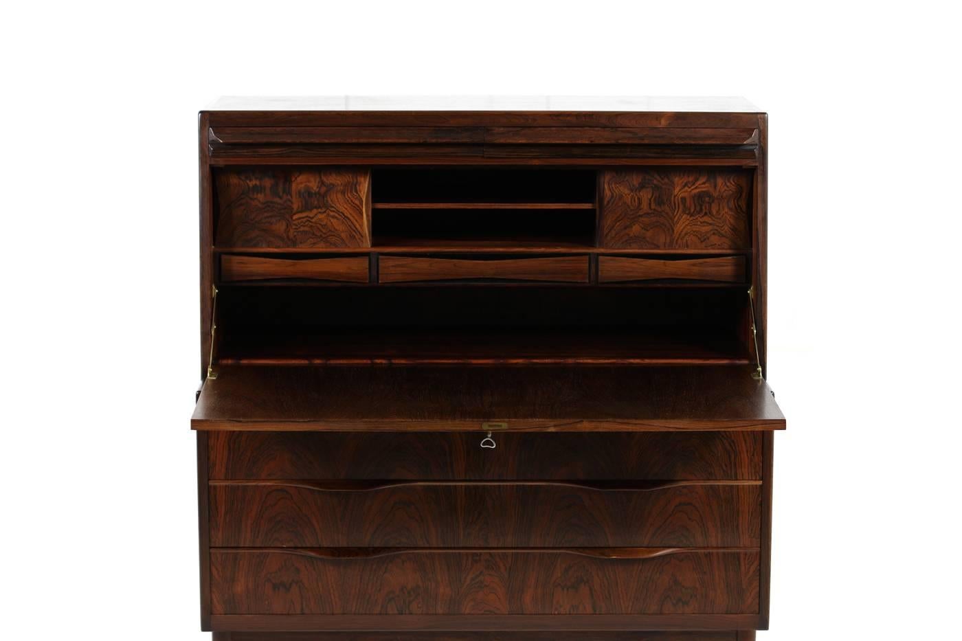 High Quality 1960s rosewood secretary, made in Denmark, Mid-Century Modern design by Erling Torvits for Klim Mobelfabrik. Rosewood and brass details, three large drawers, two hidden drawers and also three further drawers inside with two sliding