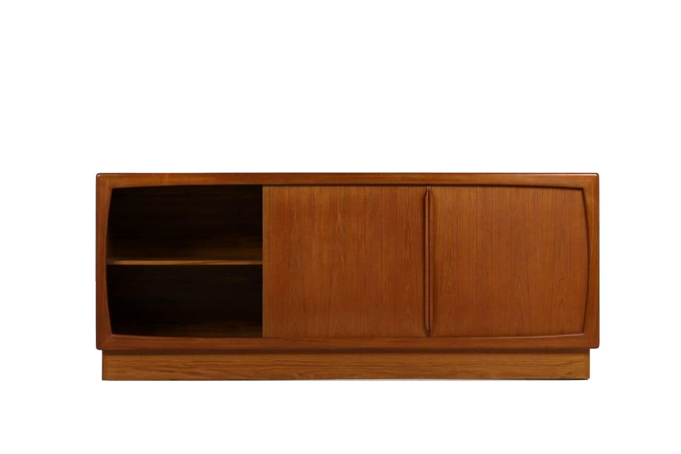 Fantastic 1960s teak sideboard, made in Denmark, with two sliding doors and 6 solid drawers. Overall a good condition, only minor wear consistent with age and use on the top. Good ans solid quality, beautiful teak colors, nice patina.
  