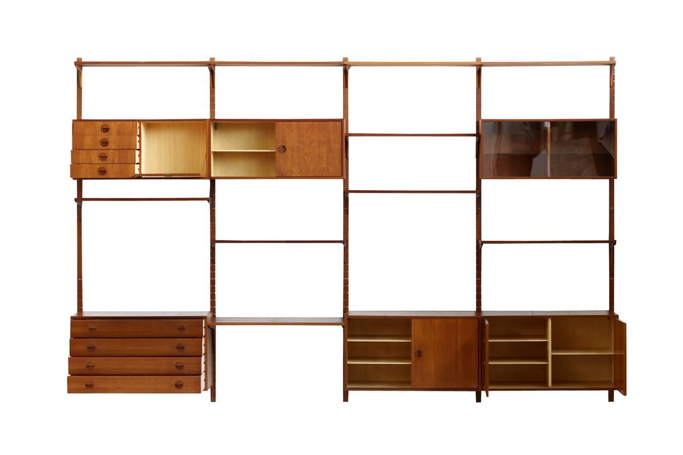 Beautiful 1960s Teak wall unit, mudular system, by Rud Thygesen and Johnny Sorensen for HG Mobler, Made in Denmark.
Measures: W x D x H ca. 360 x 42 x 235cm
Very good condition, fully modular system.
Three cabinets W x D x H ca. 89 x 40 x