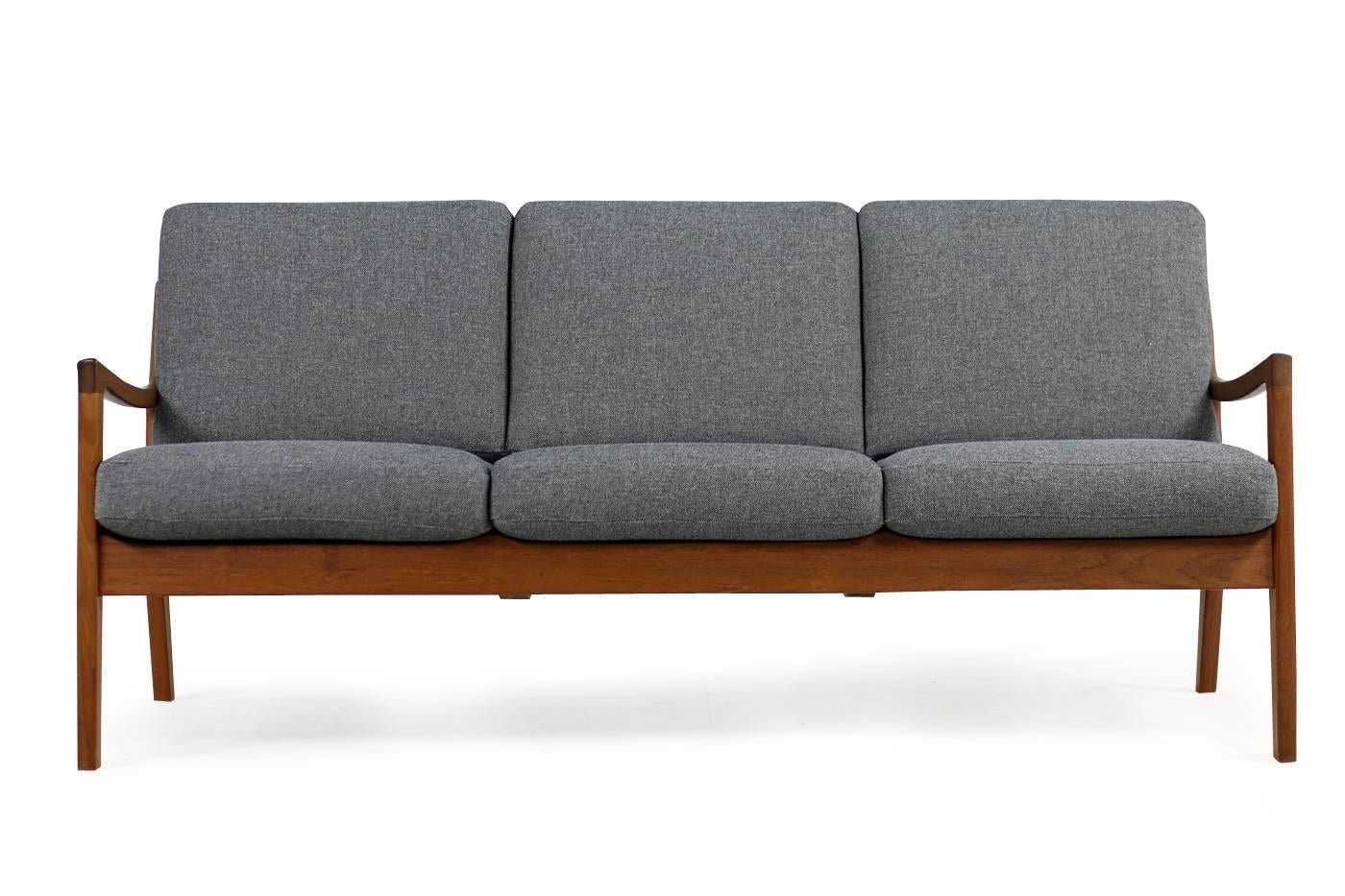 Beautiful Ole Wanscher, 1960s teak sofa, fantastic condition, reupholstered and newly covered with grey woven fabric, innerspring cushions. Very good condition, a matching pair of lounge chairs is available, please check our 1stdibs storefront.