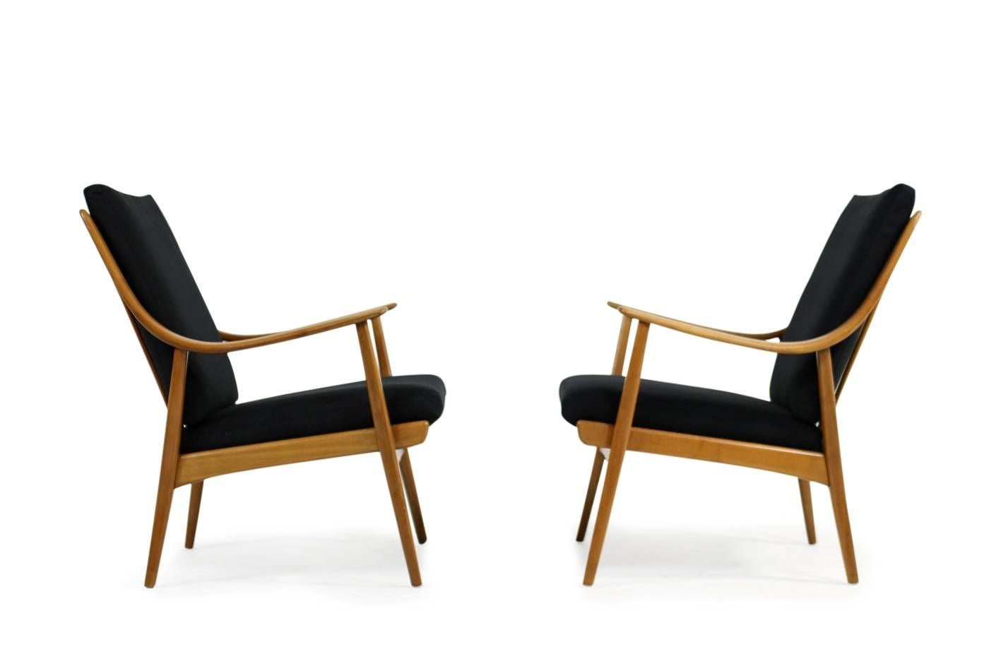 Beautiful pair of 1950s Mid-Century easy chairs, unknown designer, probably prototypes or an individual production, purchased in 1956. Very good condition, fantastic beechwood in original condition, renewed upholstery and covered with new, black