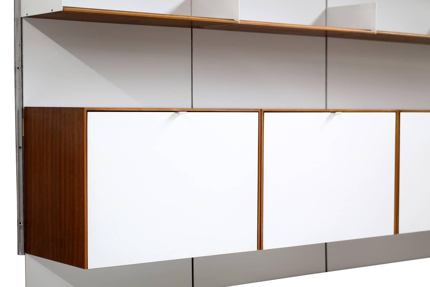 Super rare 1960s florence Knoll modular shelving, produced in 1966 by Knoll International. This rare wall unit with four cabinets in teak and laminated doors (original condition) with maple wood inside, was made/purchased in 1966 made to order. Each