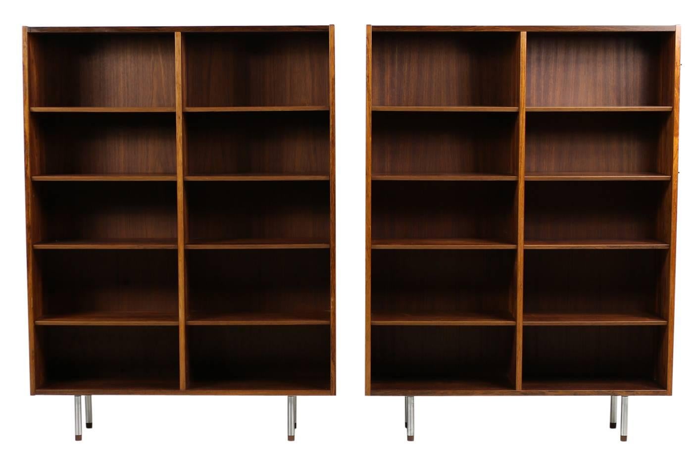 Beautiful pair of 1960s Danish Modern bookcases by Poul Hundevad, Made in Denmark. Very good condition, no holes in the back wall, adjustable shelves, overall 16 adjustable shelves and 2 units, fantastic patina and great condition. Here the higher
