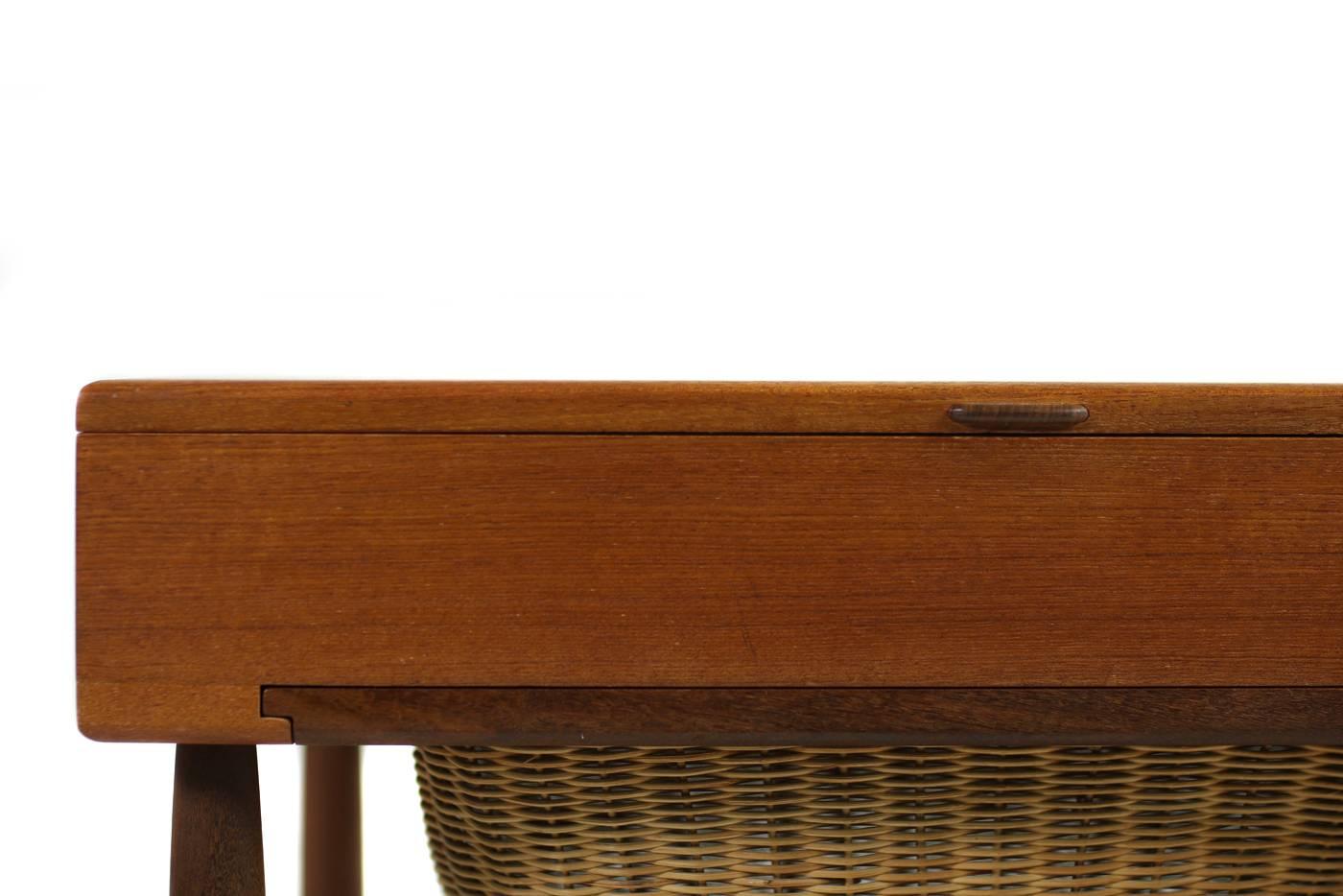 Beautiful 1950s vintage sewing table box, fantastic condition, solid teak base, brass hinges, very rare piece. Design attrib. to Hans Wegner, maybe a prototype or single piece or small edition production, Made in Denmark. The basket is in a very