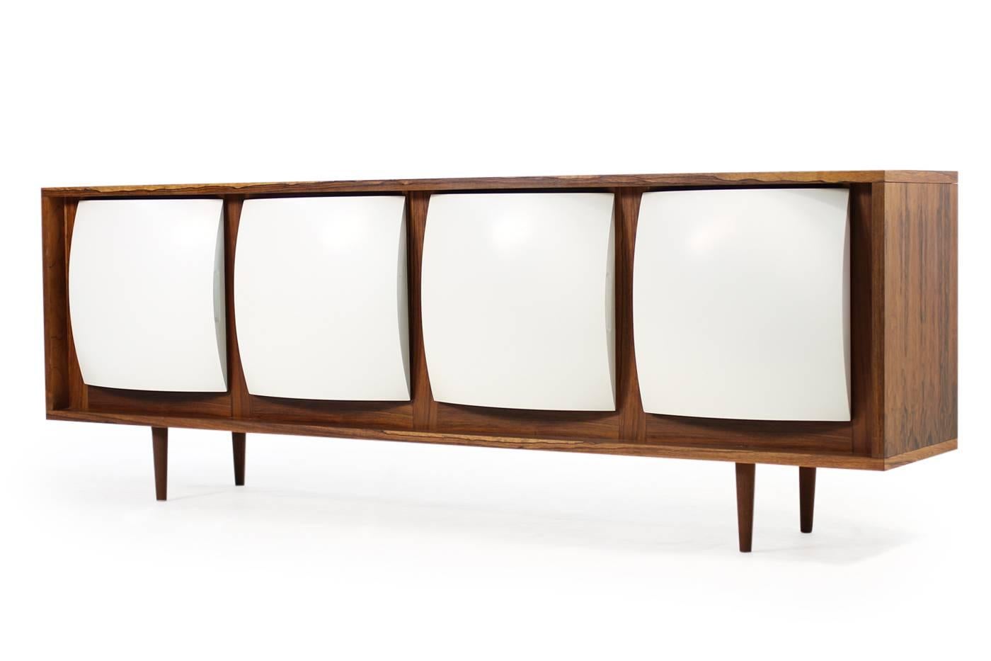Super rare / unique and large 1970s rosewood Sideboard, heavy weight, four curved formica doors. Fantastic curved doors, a kind of plastic/formica. Maybe a prototype or made to order, we never saw it before, single piece, very heavy. Shelves inside,