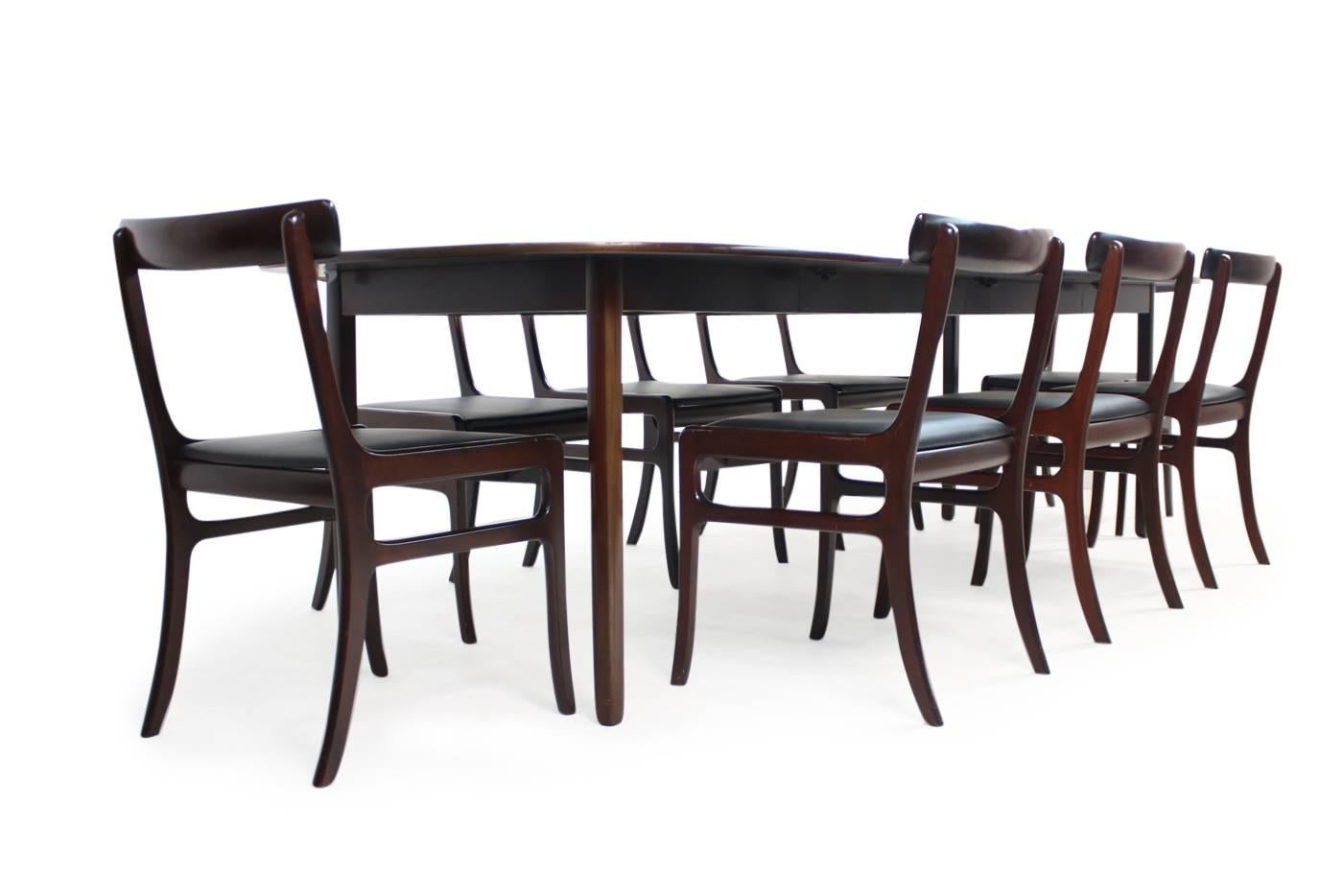 Beautiful and large 1960s dining set, by Ole Wanscher for PJ Denmark (Poul Jeppesen) made of dark mahogany, Mod. 'Rungstedlund' with eight chairs,
All eight chairs with new upholstery and covered with black real high quality leather. Very exclusive