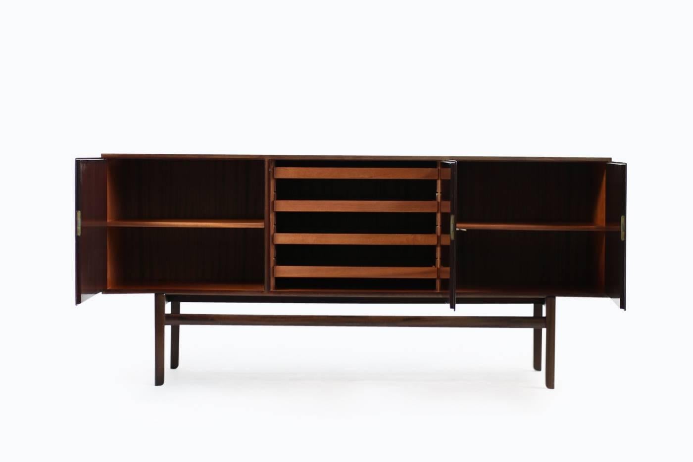 Beautiful 1960s Ole Wanscher sideboard for Poul Jeppesen, Denmark, mahogany, three doors, all keys incl. brass hinges, a matching high board is also available, please check our 1stdibs storefront.
Also available, the matching Ole Wanscher mahogany